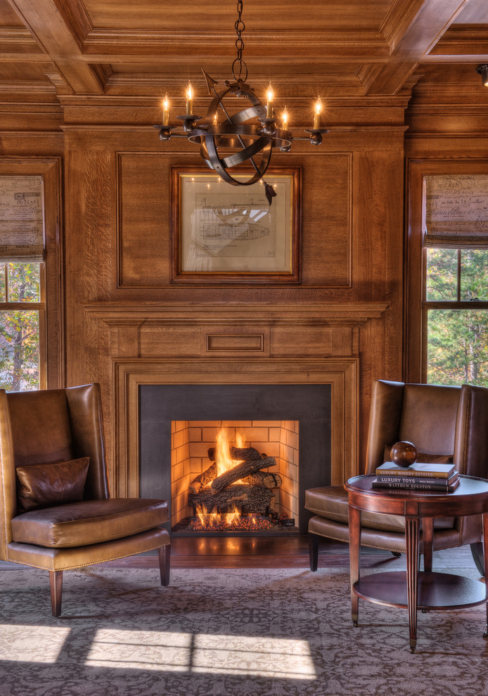Leather chairs in front of fire place