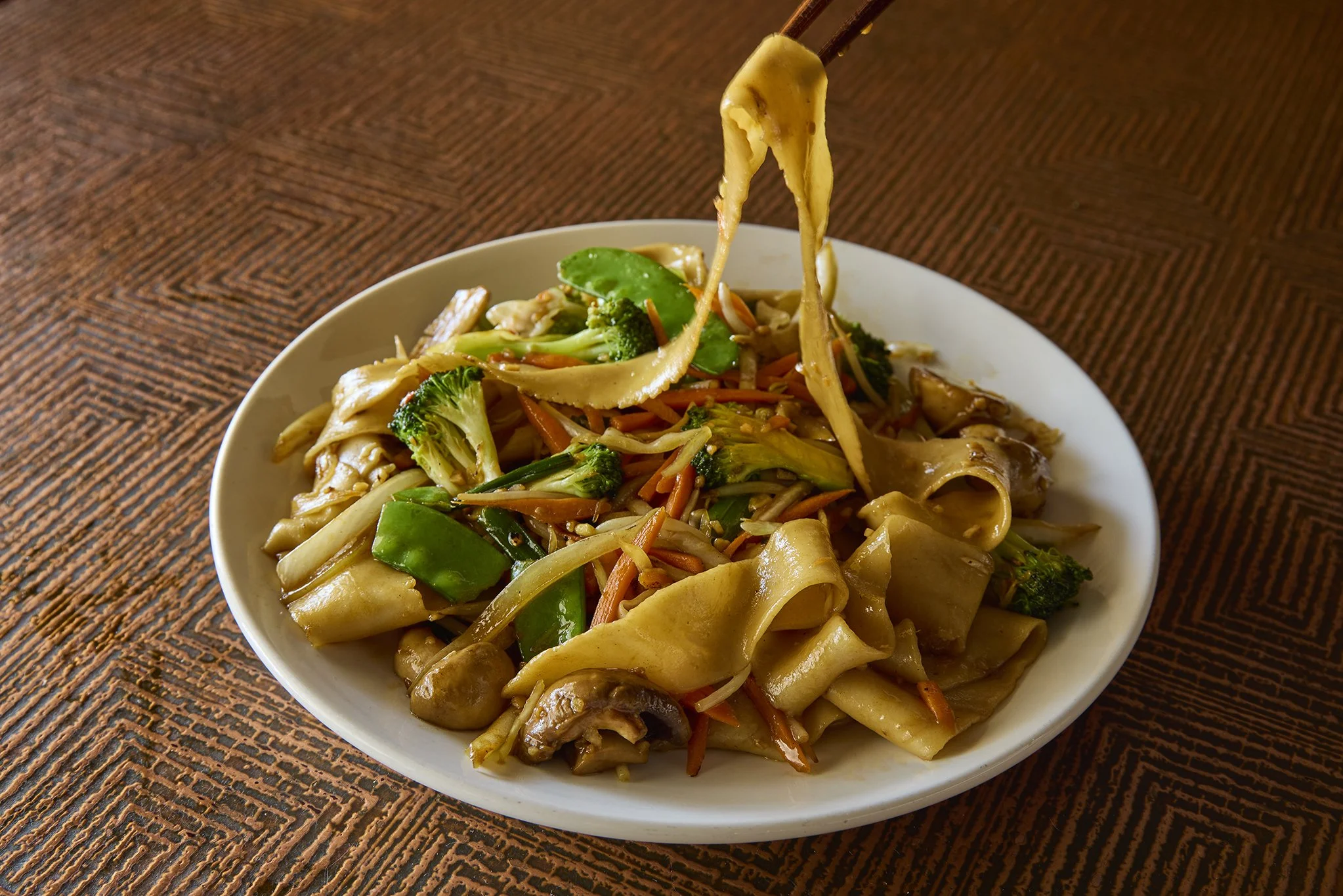 The Stir fried la mian, hand-made wide and flat noodles stir fried with an assortment of mixed vegetables, served at Royal China