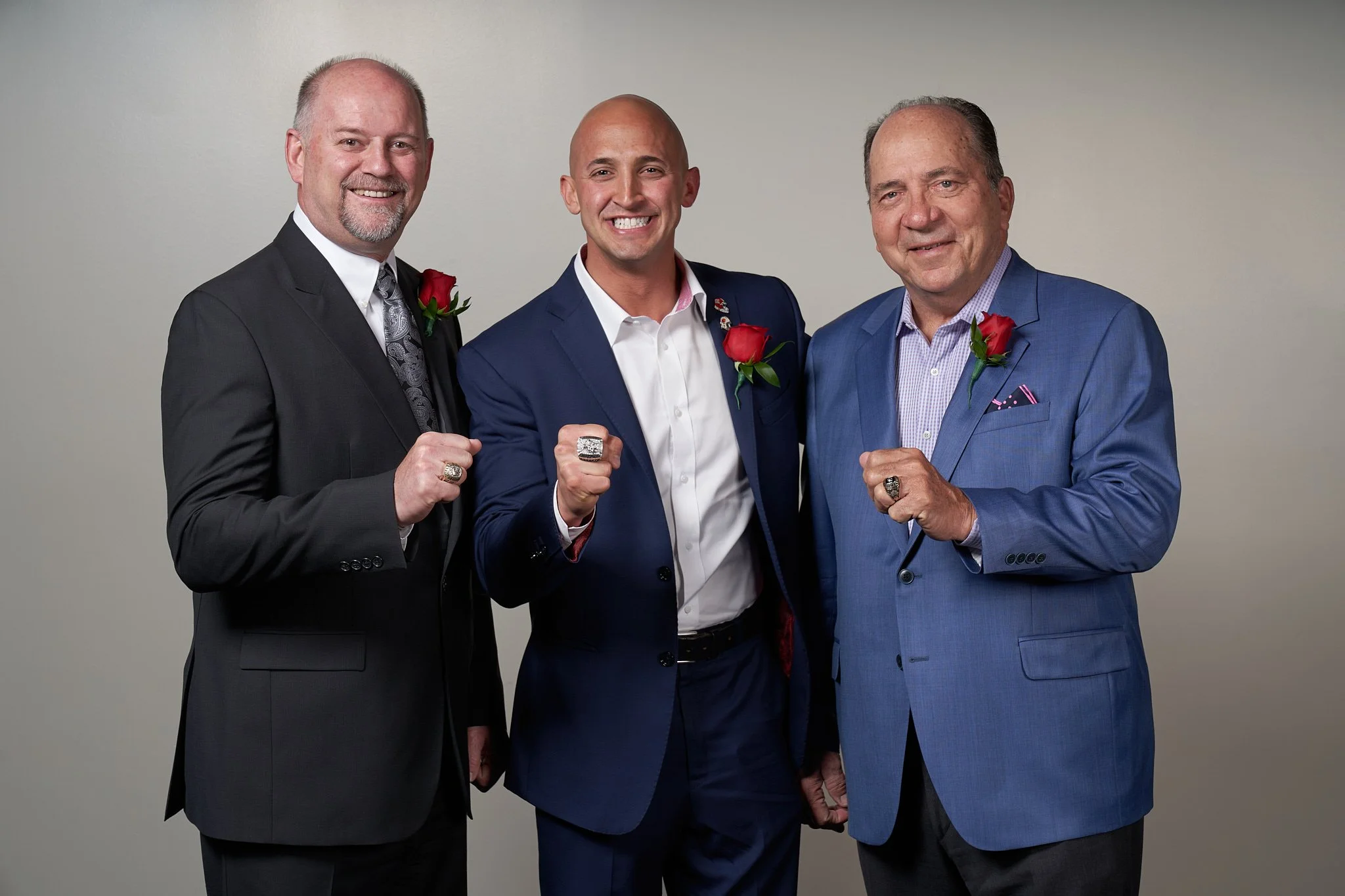 Baseball Hall of famer Johnny Bench, Marco Iannuzzi and Colin Patterson showing their championship rings at the Italian Sportsman Dinner in Calgary. Brotherhood victory celebration photographed by Stance Creative.