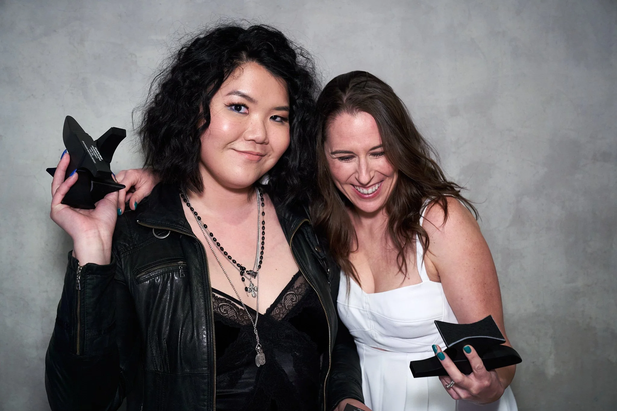 Two women posing with their Anvil awards at Telus Spark. Captured by Stance Creative professional event photography.