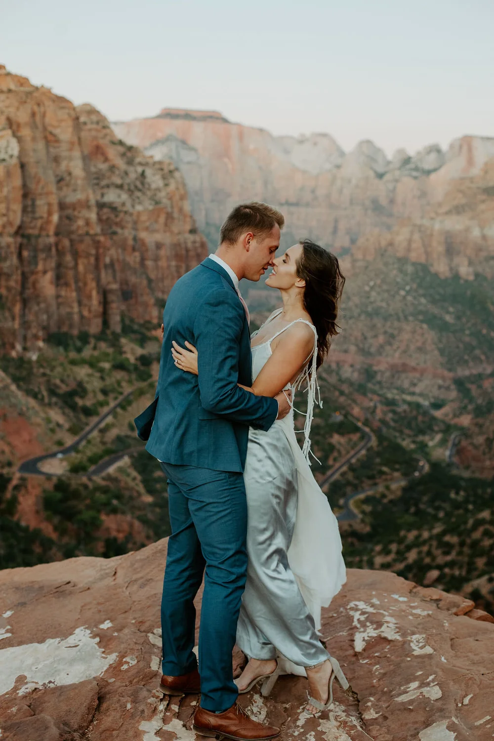 Skye wedding dress with blue jumpsuit and silk chiffon overdress.  Daci  Gowns