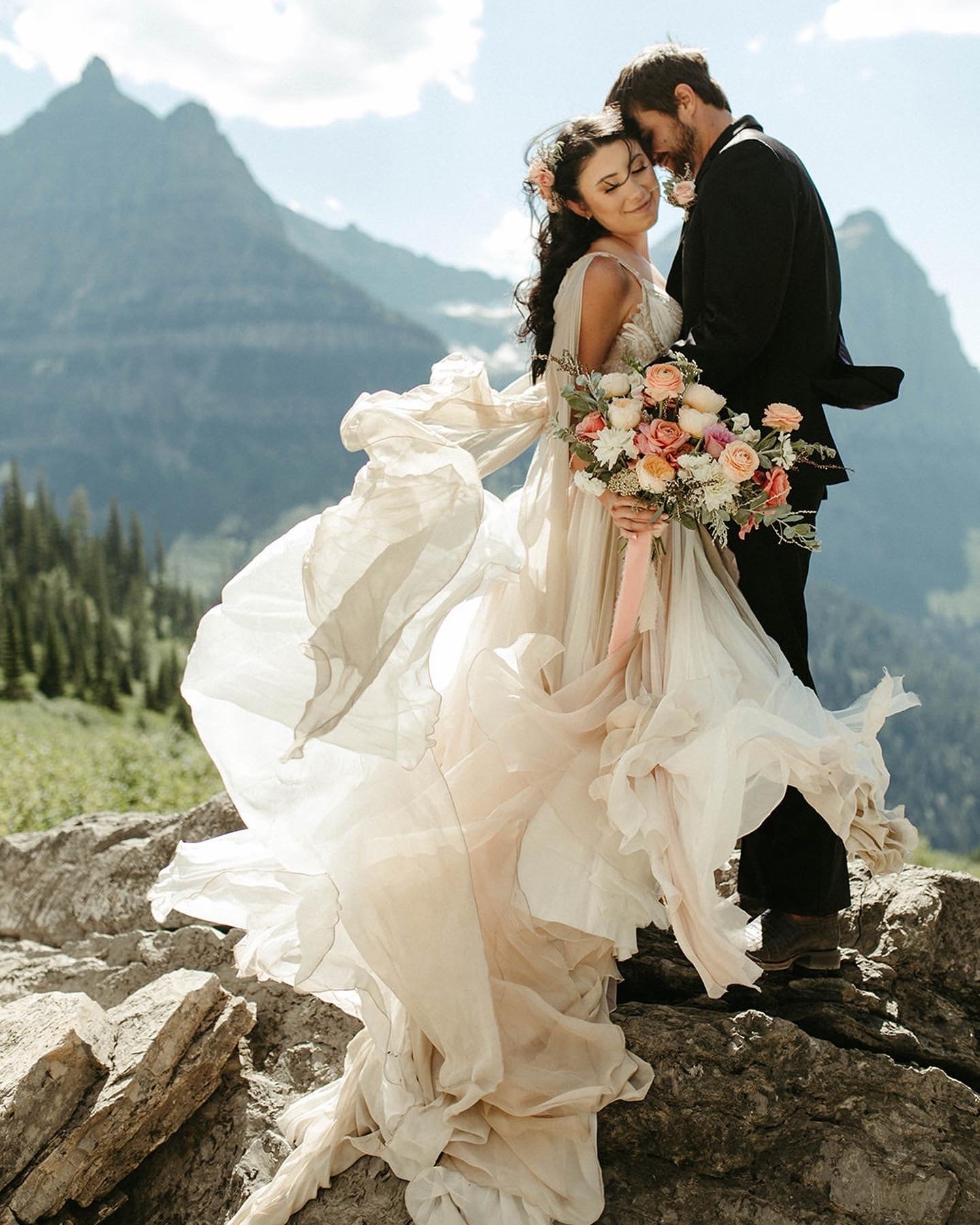   Swan wedding dress . Bride Joelle’s elopement in Glacier National Park Montana. Photo by  Dina Remi Photography.   