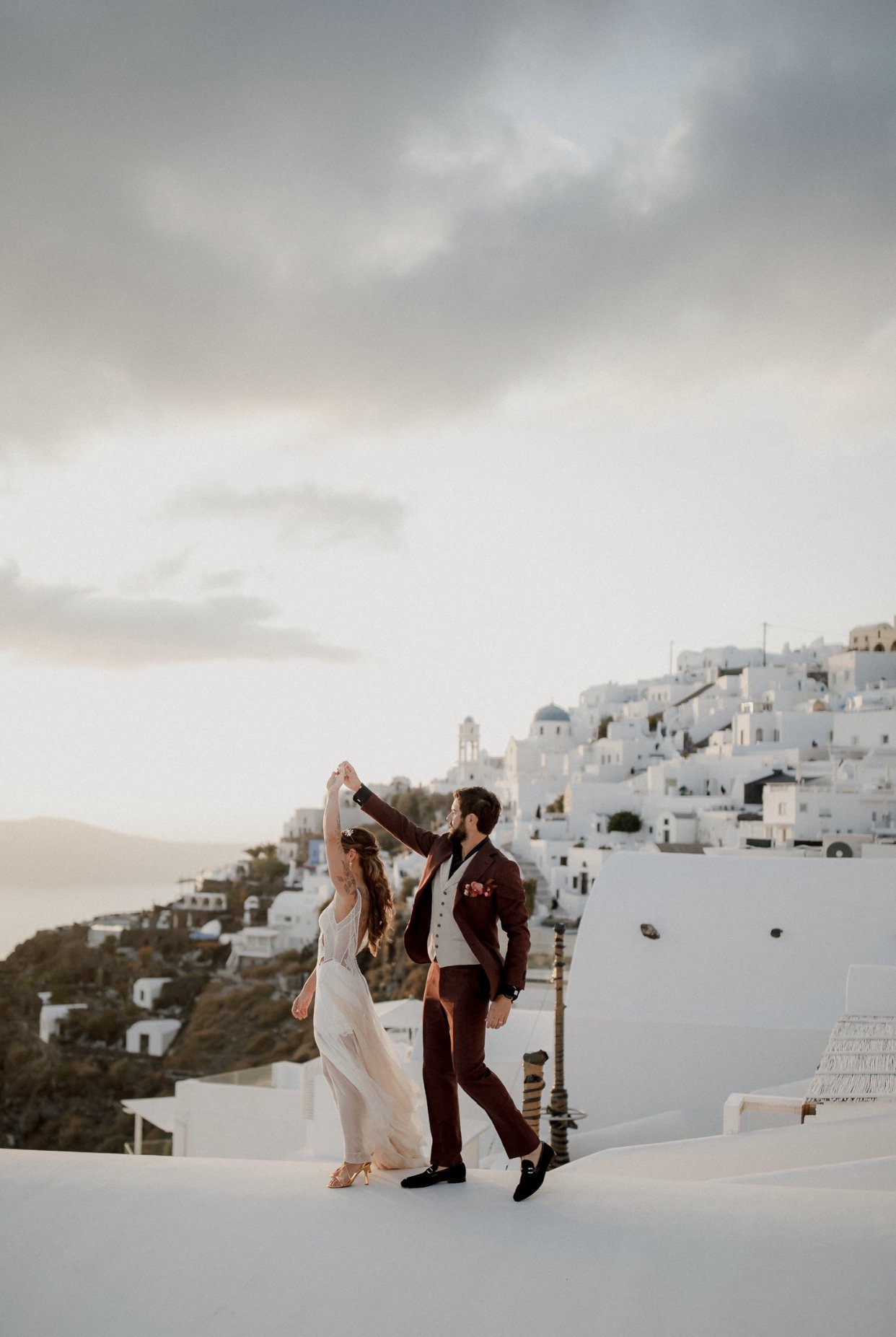   Mia wedding dress.  Bride Chelsea’s elopement in Santorini, Greece. Photo by  White on Black Studio.   