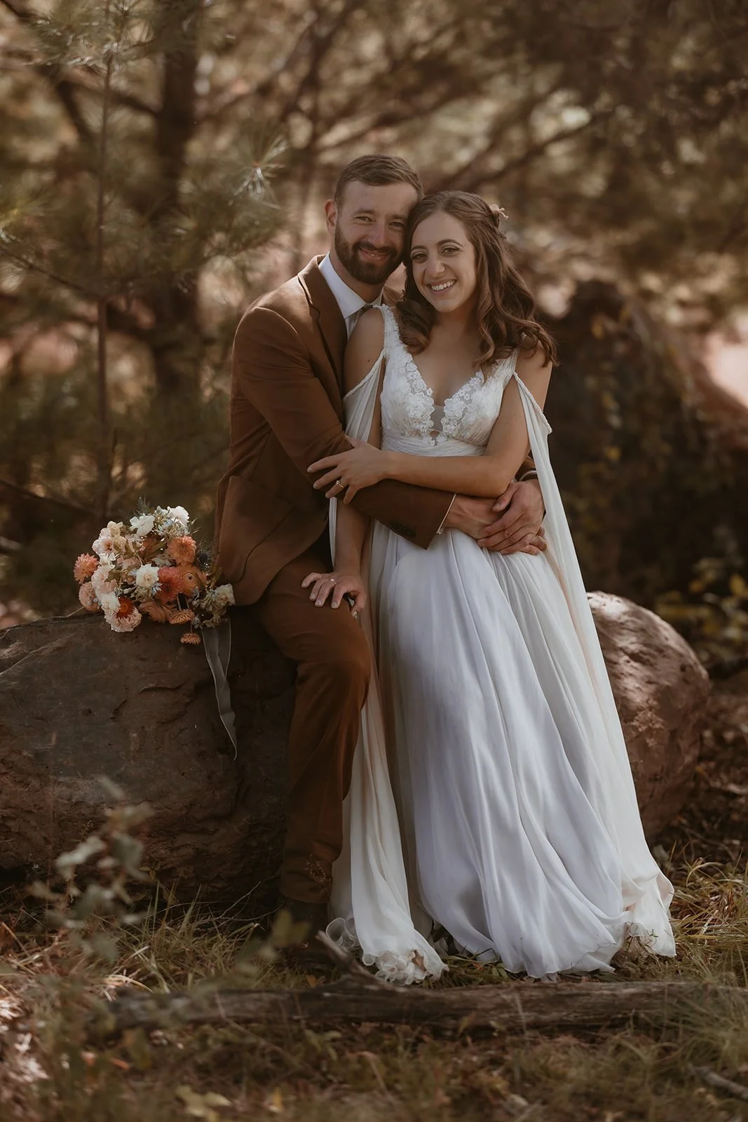 Dusty blue and gray hues were added to the original Summer wedding dress off-white and champagne.