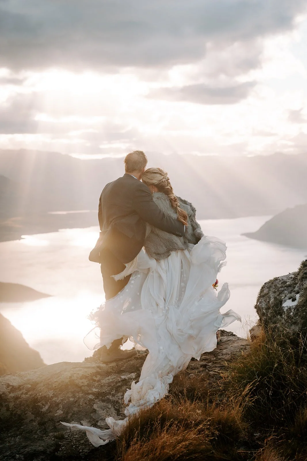 Romantic silk chiffon elopement dress overlooking Lake Wakatipu in New Zealand