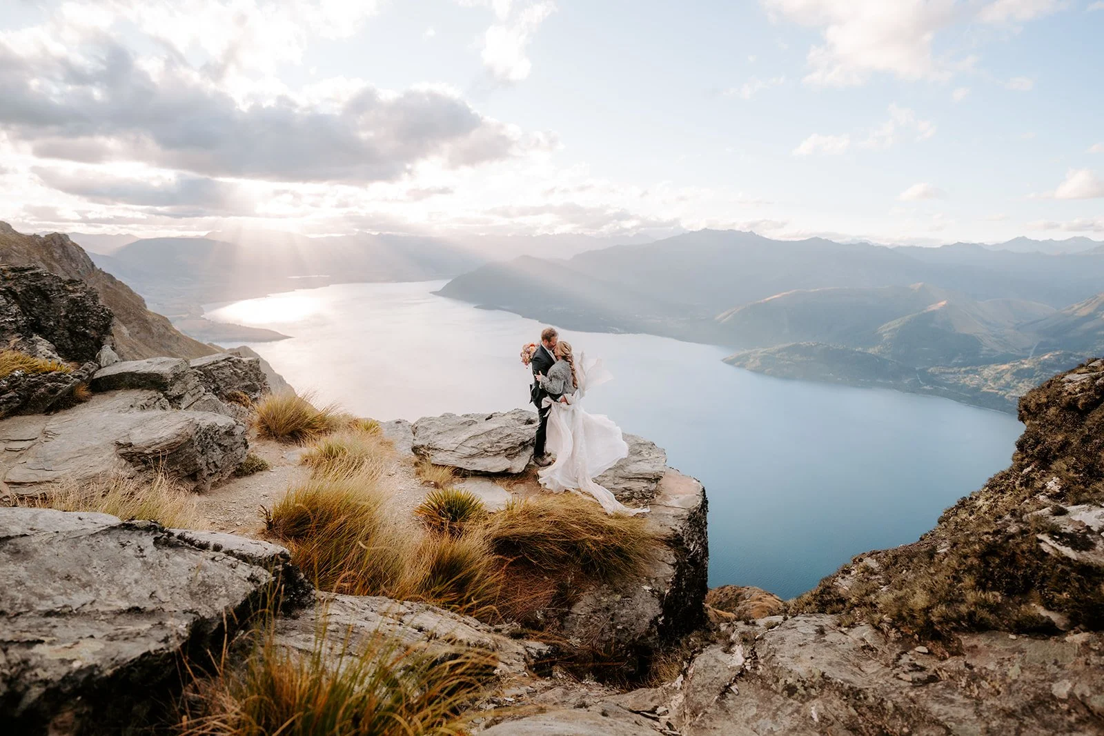 Romantic silk chiffon elopement dress overlooking Lake Wakatipu in New Zealand