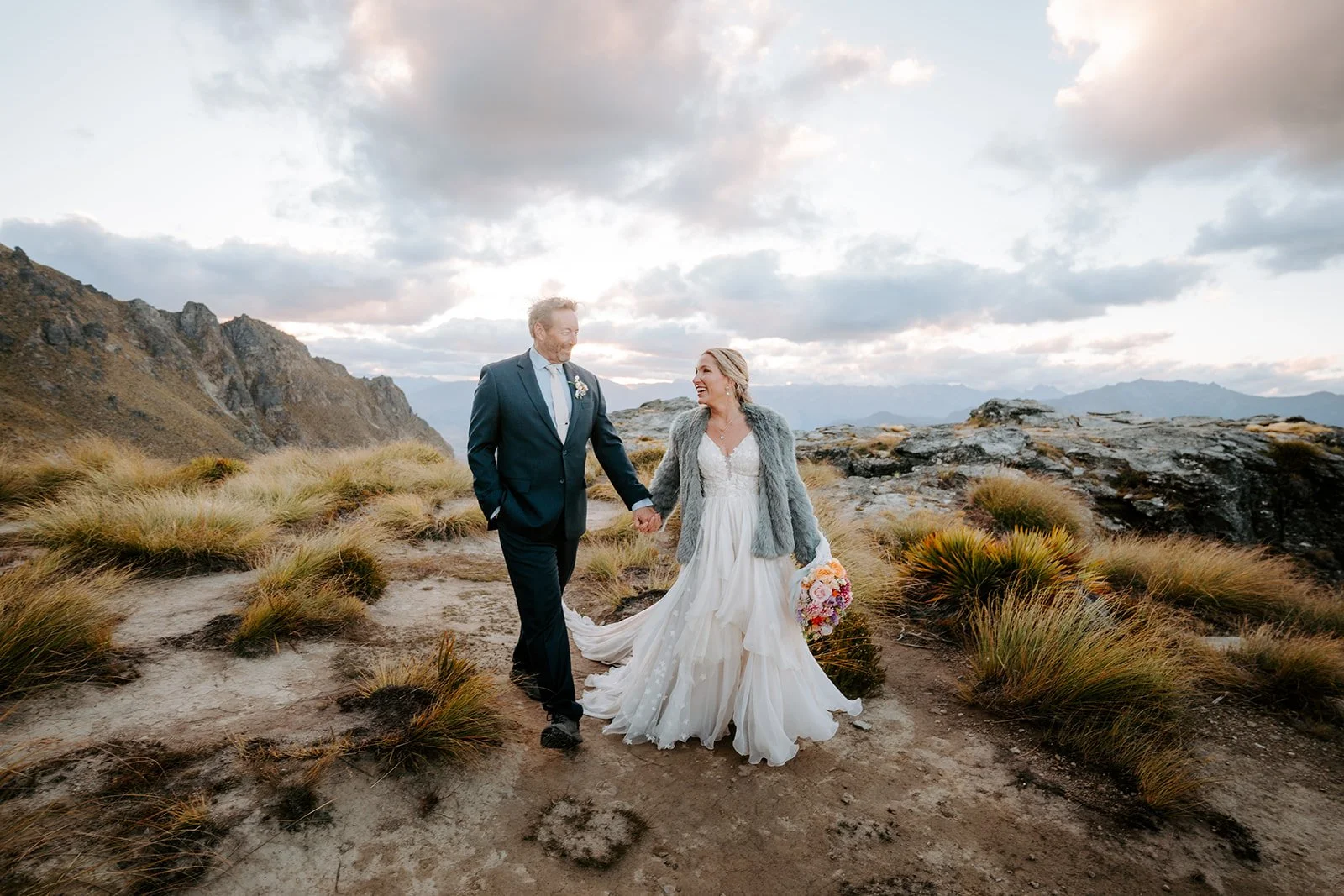 Lightweight silk chiffon elopement dress overlooking Lake Wakatipu in New Zealand