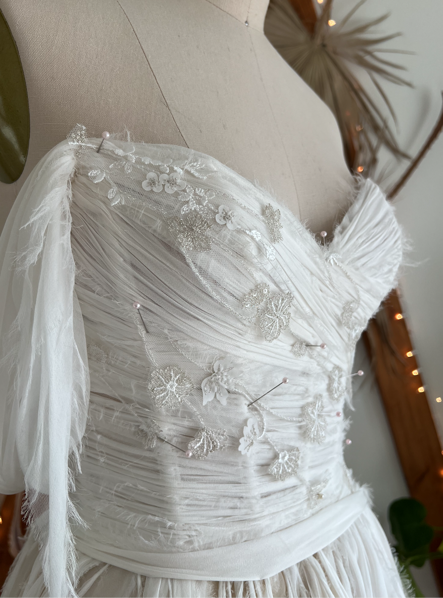 Claire reimagined: embroidered wildflowers lace detail on the corset bodice