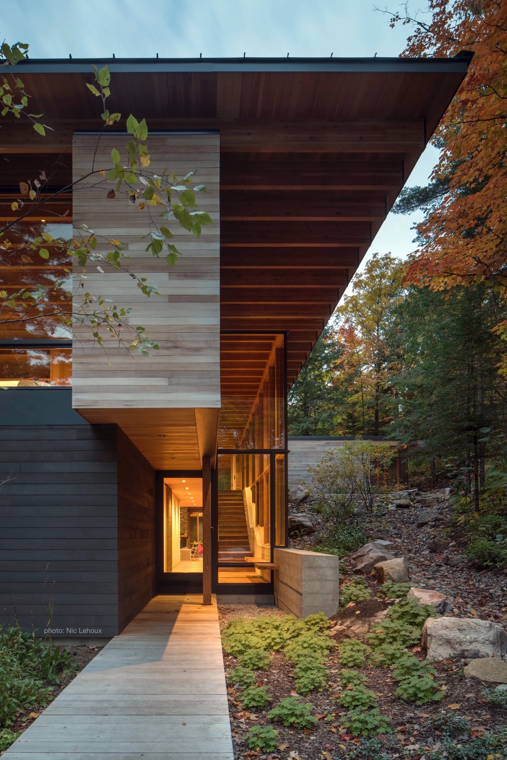 Warm Glow from the Entry Hall of This Modernist Home Beckons Visitors In