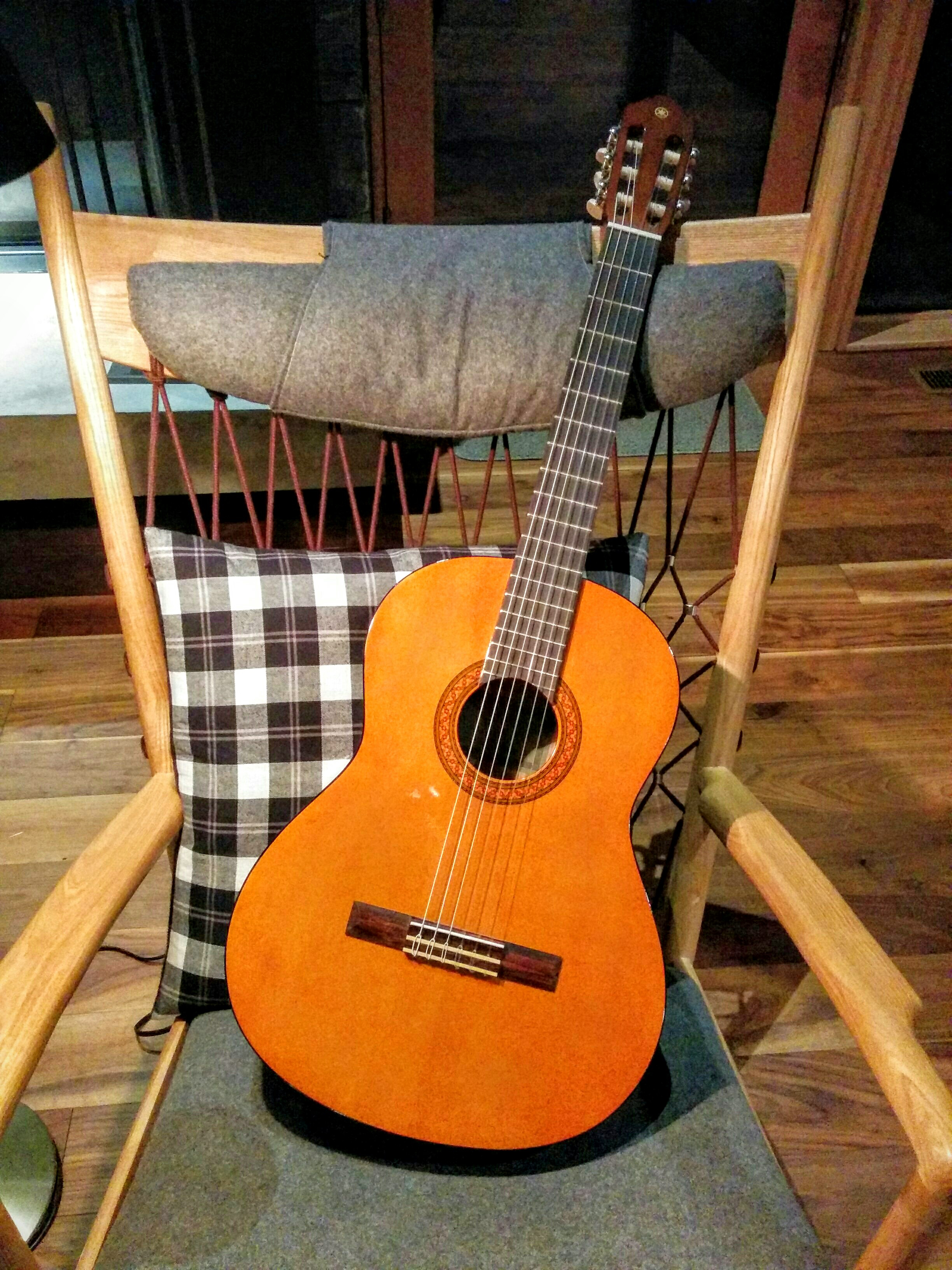 A Guitar Waits Patiently in the Great Room for the Evening's Guests to Arrive