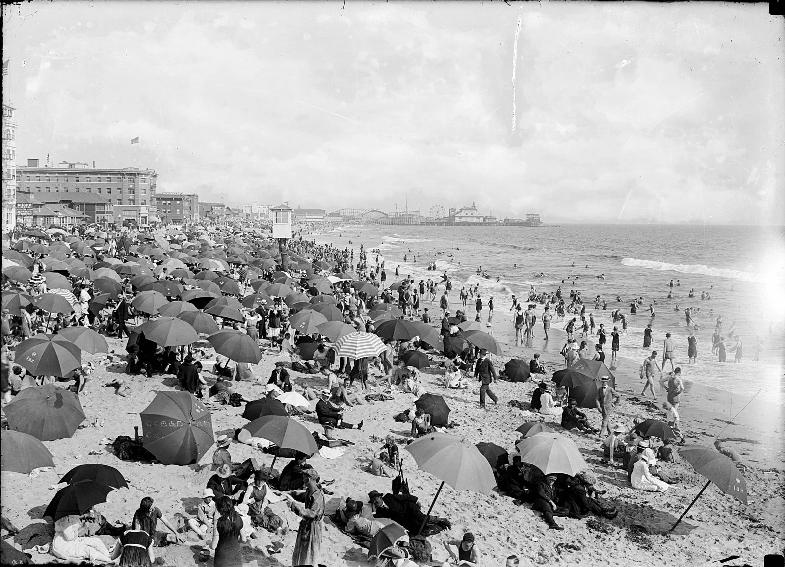 Ocean_Park_Beach_in_Santa_Monica_crowded_with_bathers,_ca.1910_(CHS-11211).jpg
