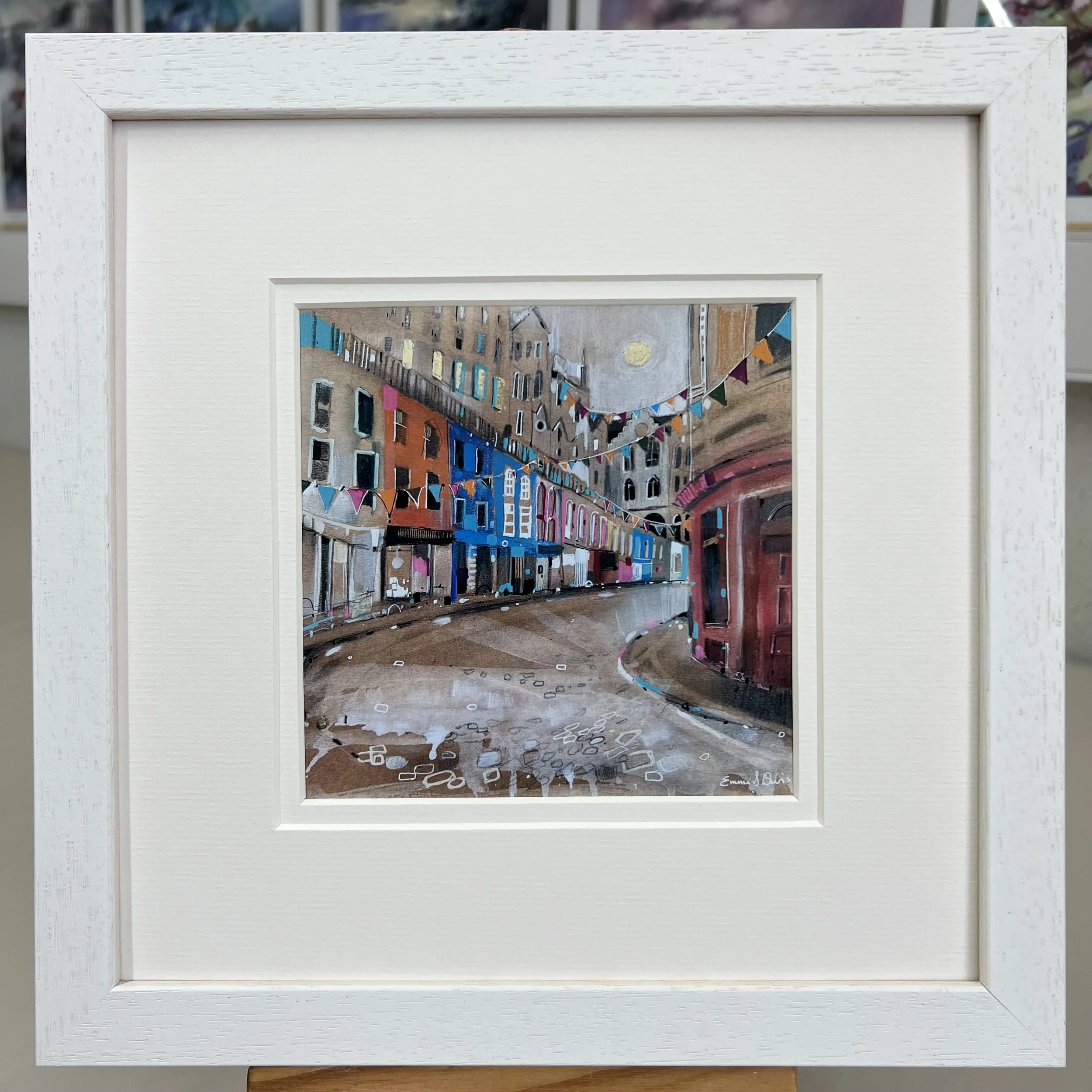 Bunting Victoria Street Edinburgh framed art card featuring colourful bunting and the famous curved street in Edinburgh, Scotland. Framed white double mount.
