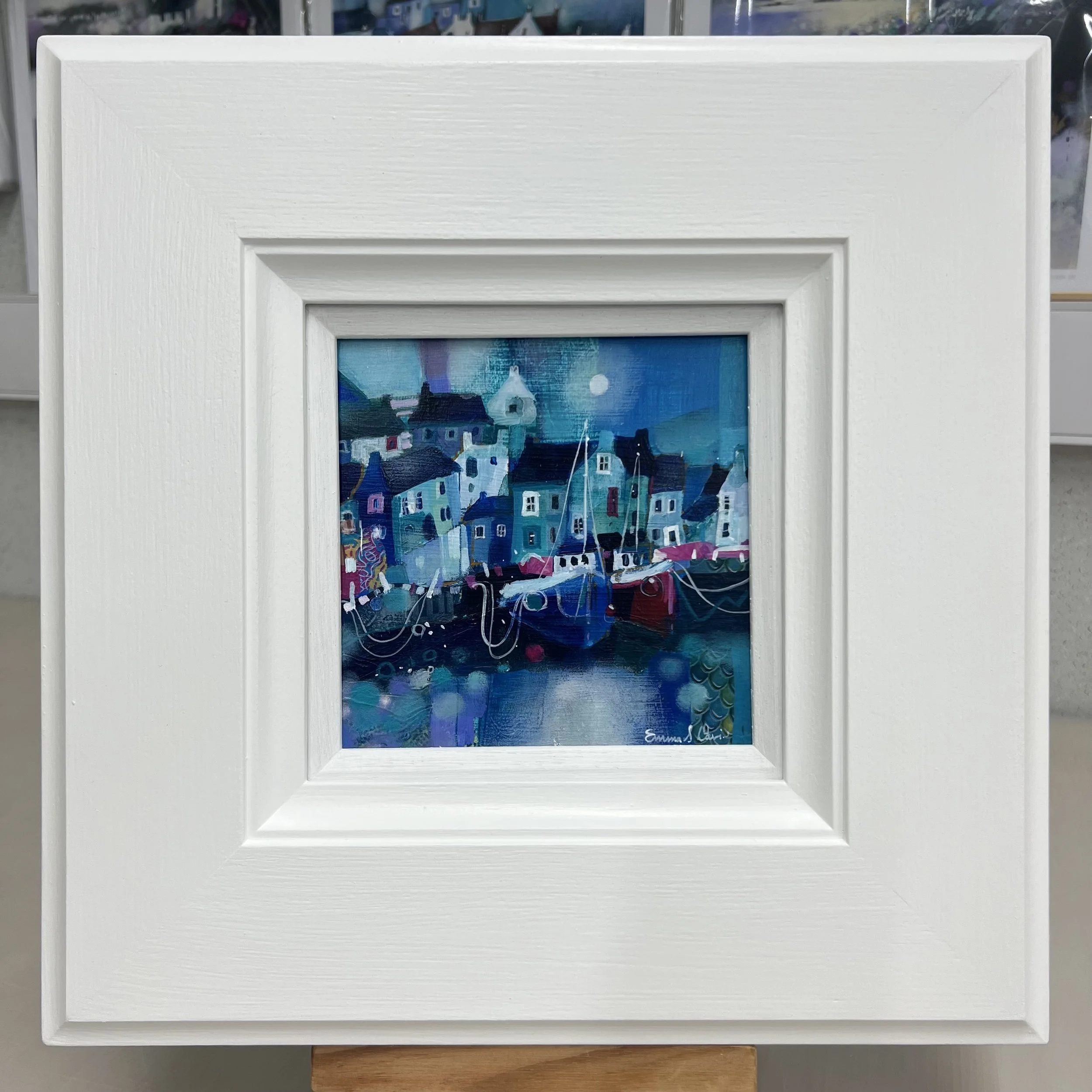 Original oil painting of fishing boats in Pittenweem harbour beneath a moonlit sky by Scottish artist Emma S Davis. Framed view.