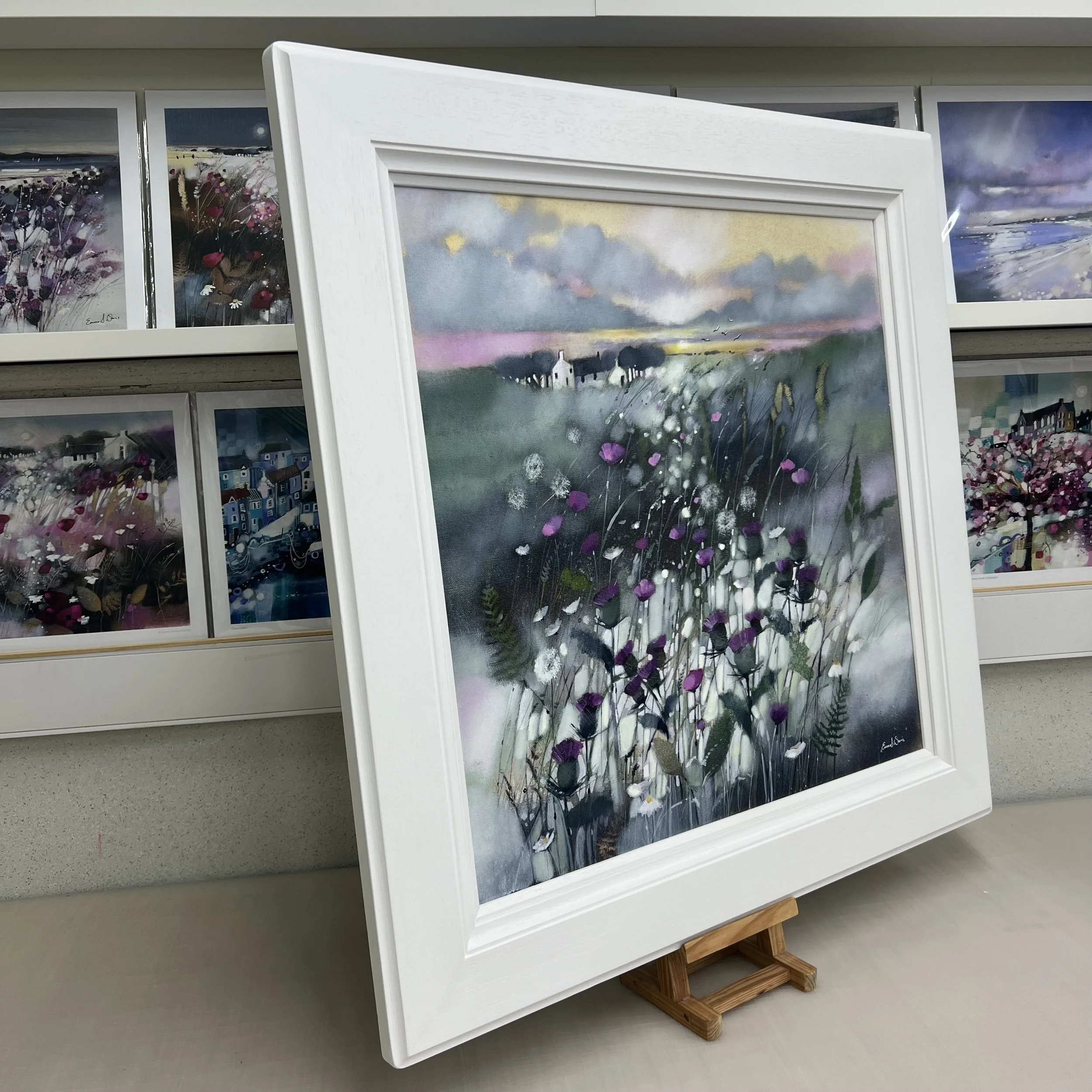 Original oil painting of Scottish thistles and wildflowers surrounding a Highland croft at sunset by Scottish artist Emma S Davis. Side view.