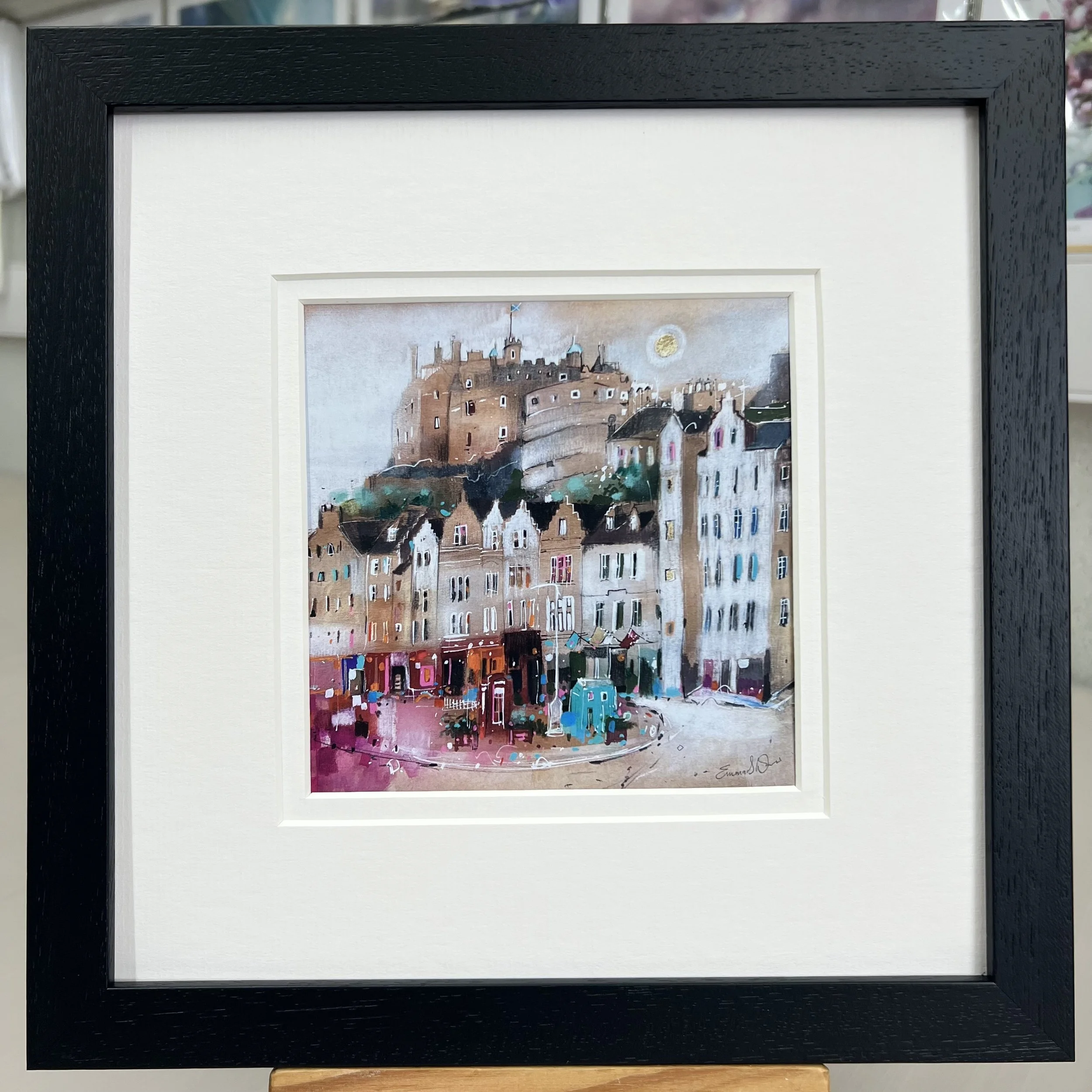 Moonlight Grassmarket Edinburgh framed art card featuring Edinburgh Castle overlooking the historic Grassmarket area of Edinburgh. Framed black double mount.