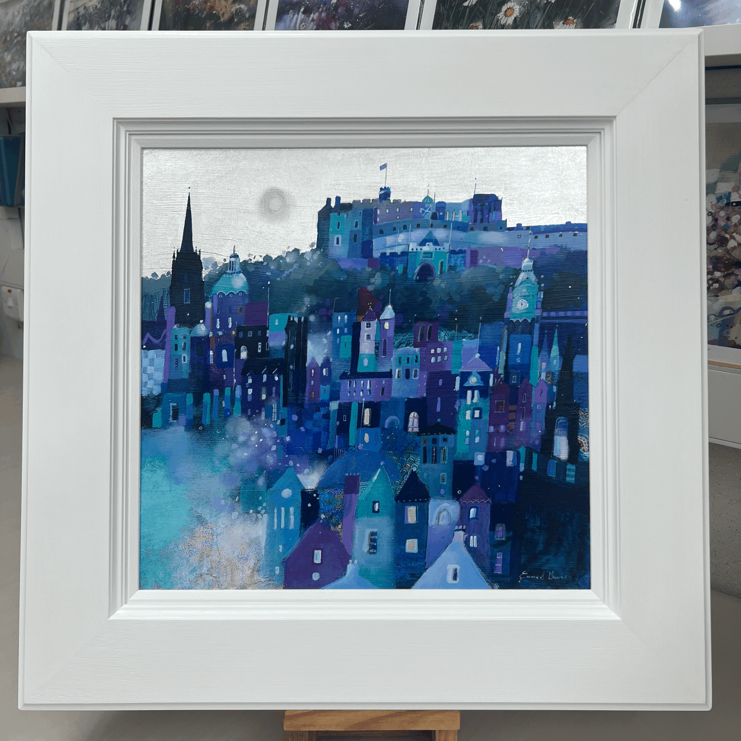 Original oil painting of Edinburgh Castle and the Edinburgh skyline in blue and teal tones by Scottish artist Emma S Davis. Framed view.