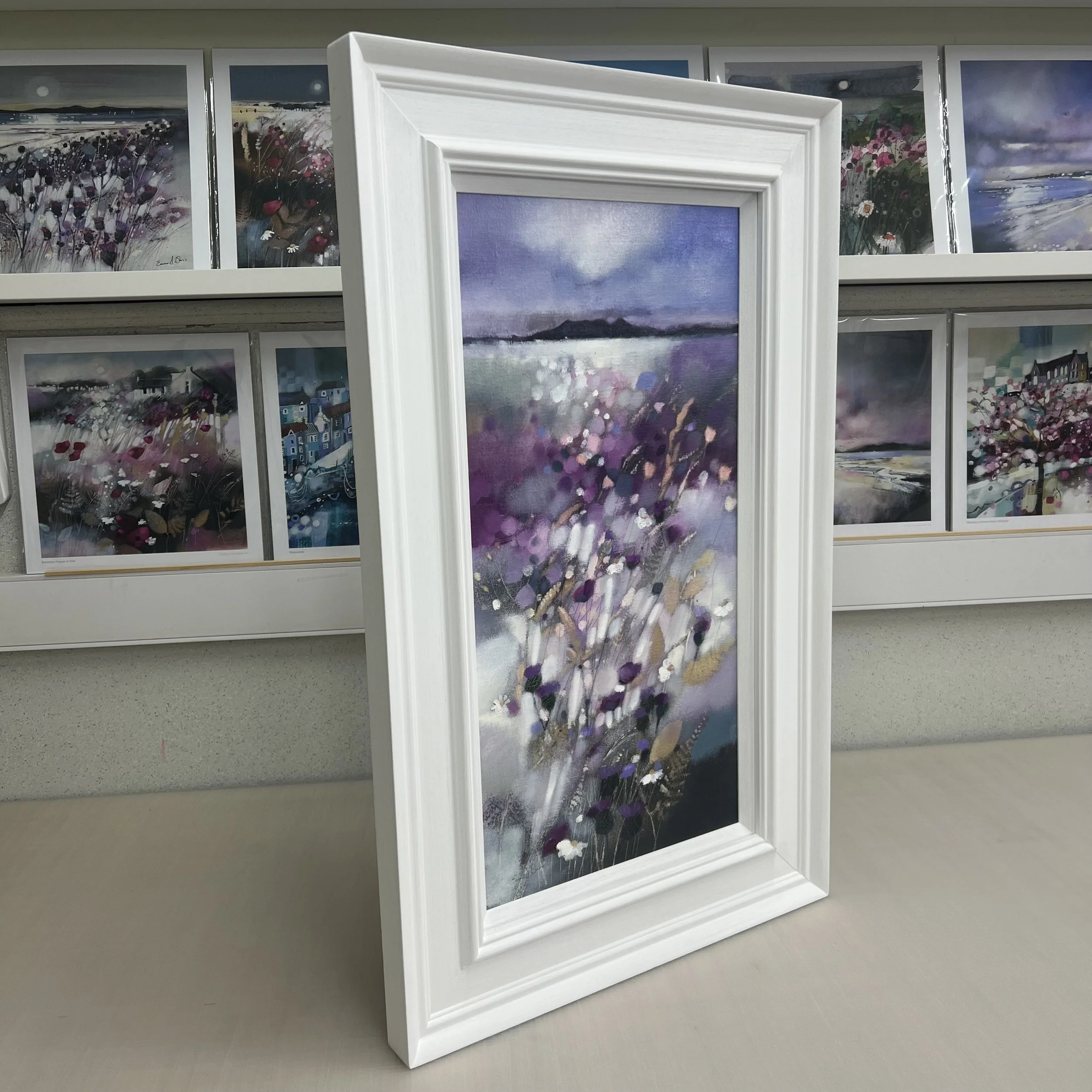 Framed original Arran painting showing the silhouette of the Isle of Arran from the Ayrshire coast. Side view.