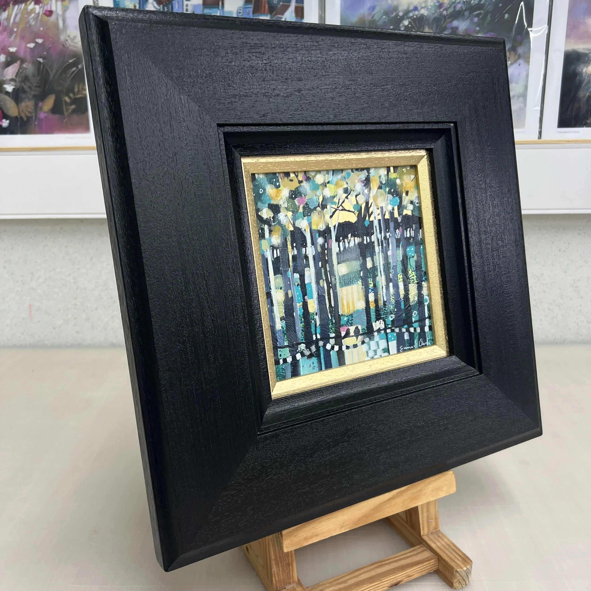 Original oil painting of a Scottish landscape glowing with warm golden evening light by Scottish artist Emma S Davis. Side view.