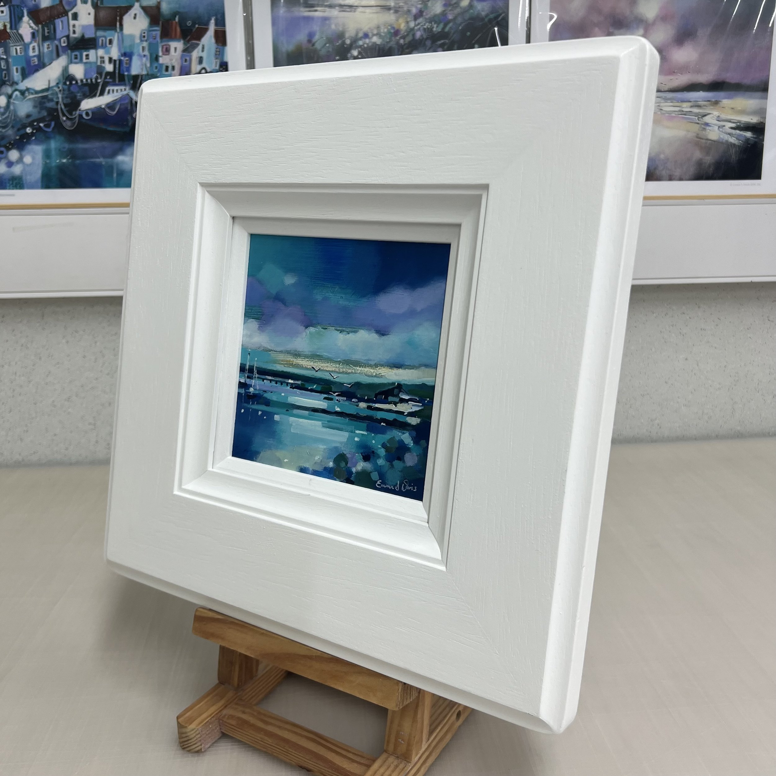 Original oil painting of a white boathouse on the Isle of Gigha surrounded by wildflowers and coastal scenery by Scottish artist Emma S Davis. Alternate view.