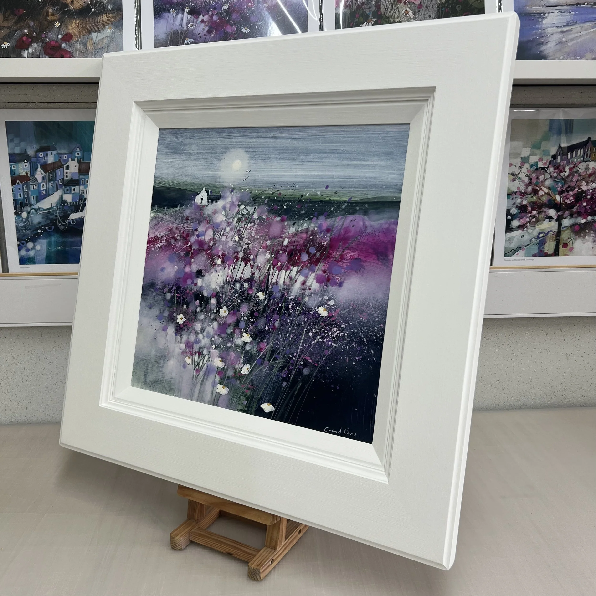 Dancing in the Moonlight by Emma S Davis – original Scottish landscape oil painting featuring a white cottage beneath a glowing moon surrounded by pink and purple wildflowers. Alternate view.