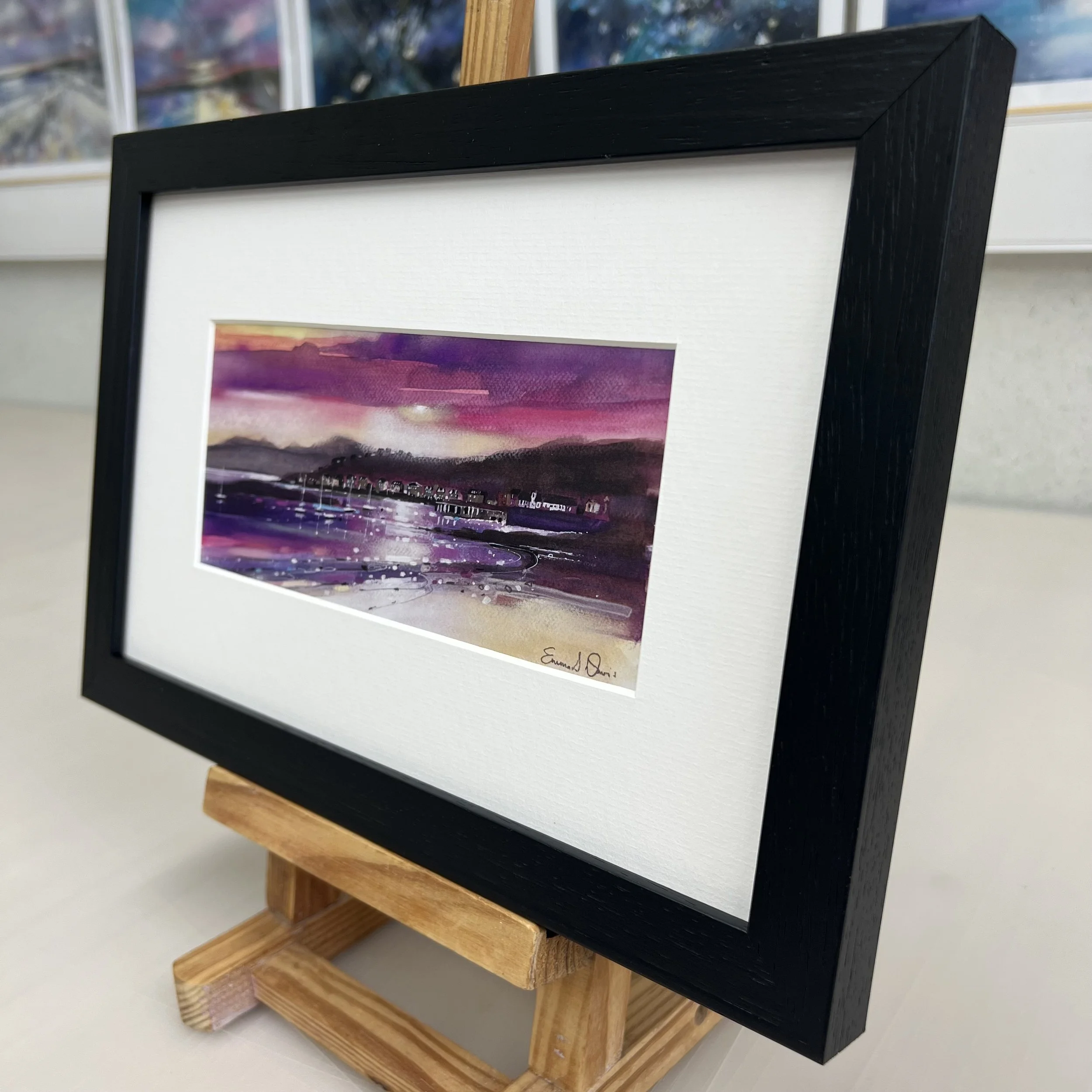 View to West Bay, Millport - Framed Greetings Card by Emma S Davis Artist - black frame - angled view