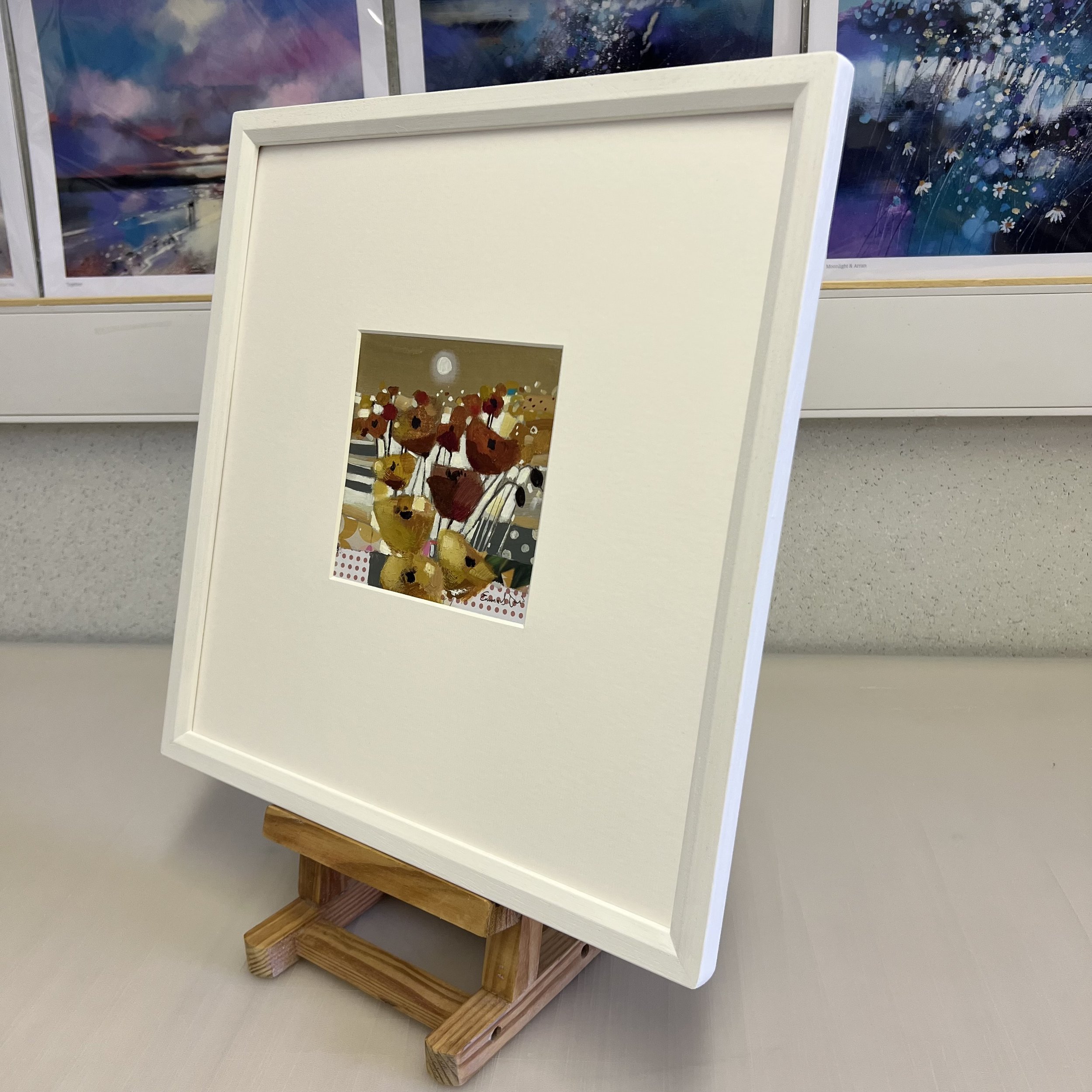 Side view of Golden by Emma S Davis Artist, an abstract small original painting displaying rich poppy filled fields of colour under a moonlit sky.