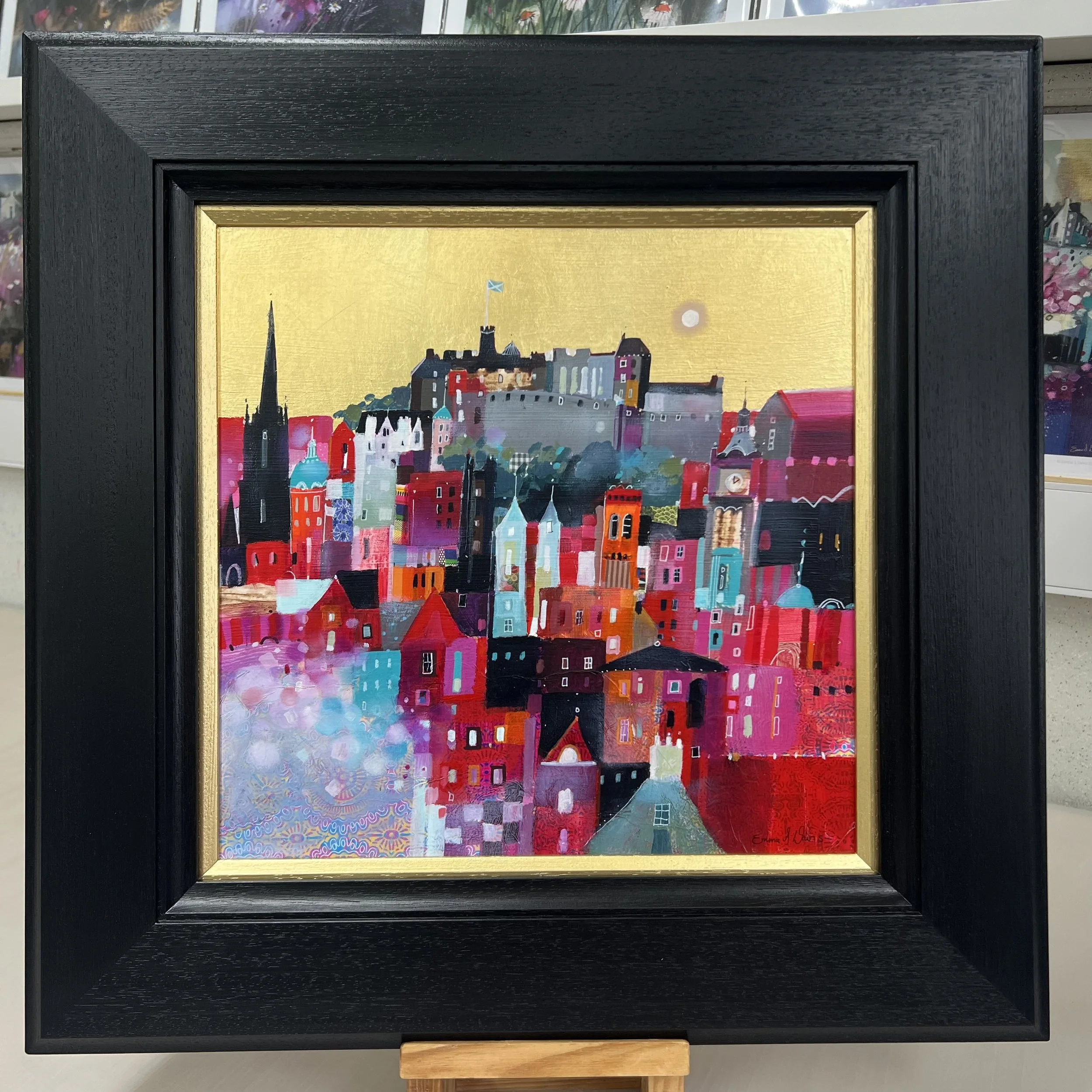 Original oil painting with gold leaf of Edinburgh Castle and the colourful Edinburgh skyline by Scottish artist Emma S Davis. Framed view.