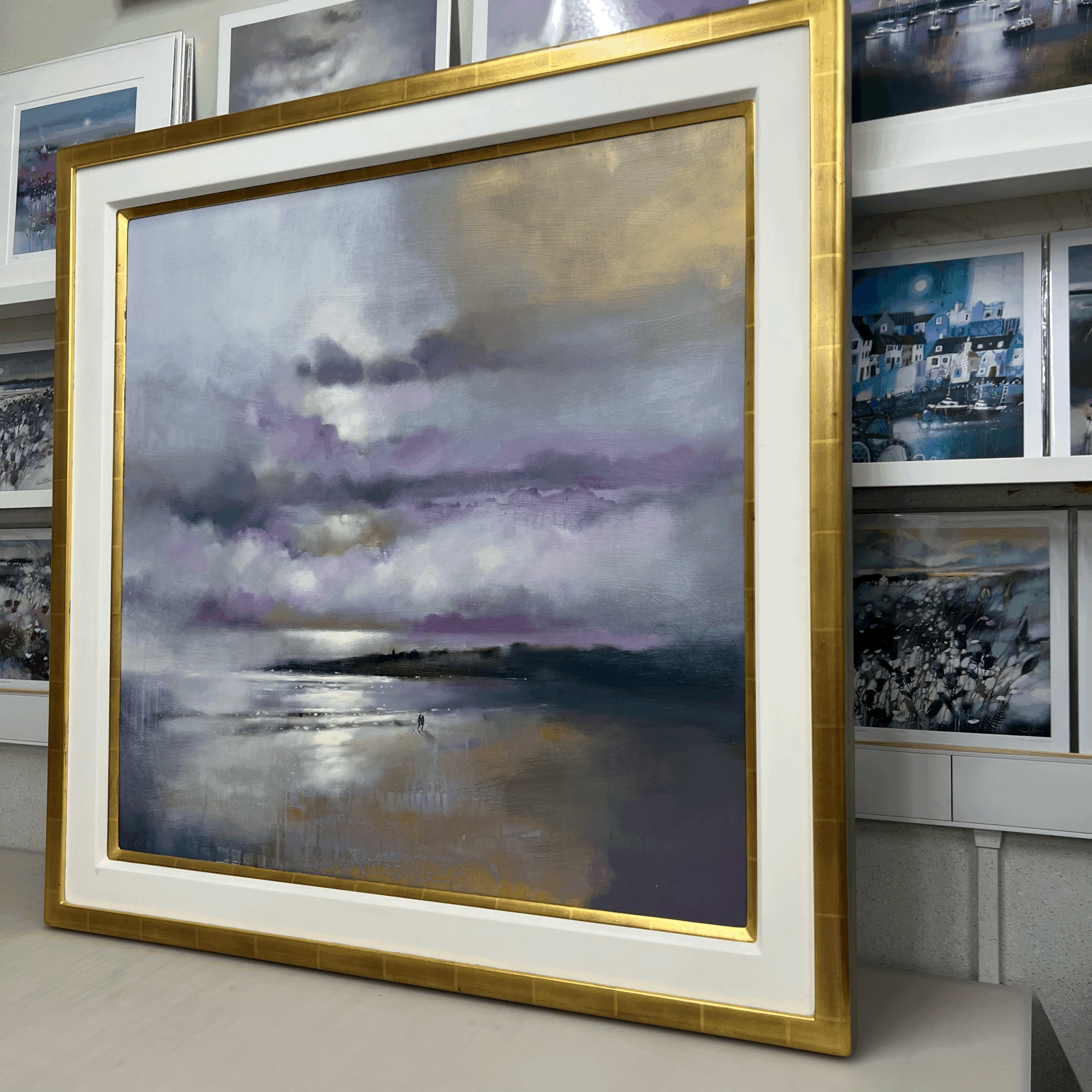 Together, St Andrews by Emma S Davis original oil painting featuring two figures walking along the shoreline beneath dramatic skies. Alternate view.