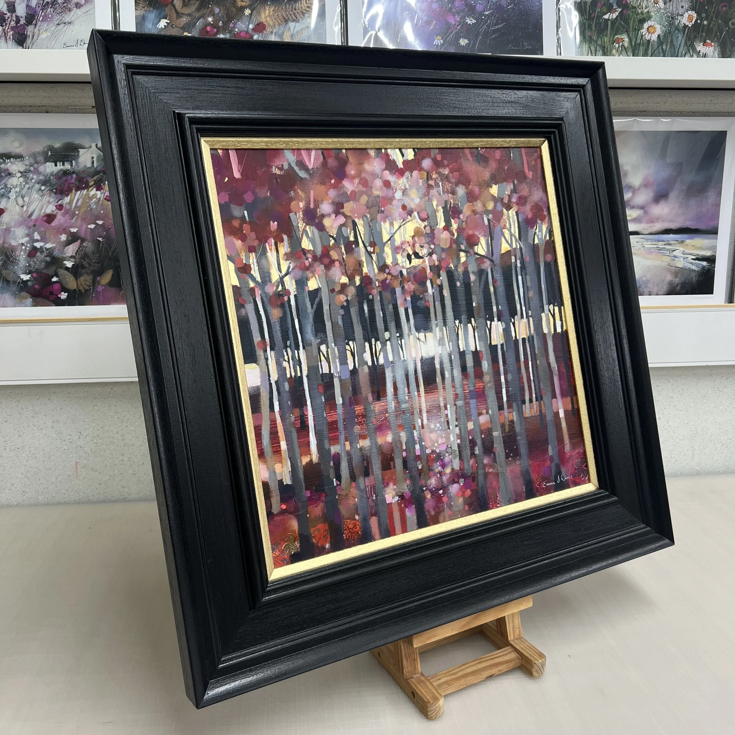 Original oil painting of two birds perched in a silver birch woodland with pink blossom and golden light by Scottish artist Emma S Davis. Side view.