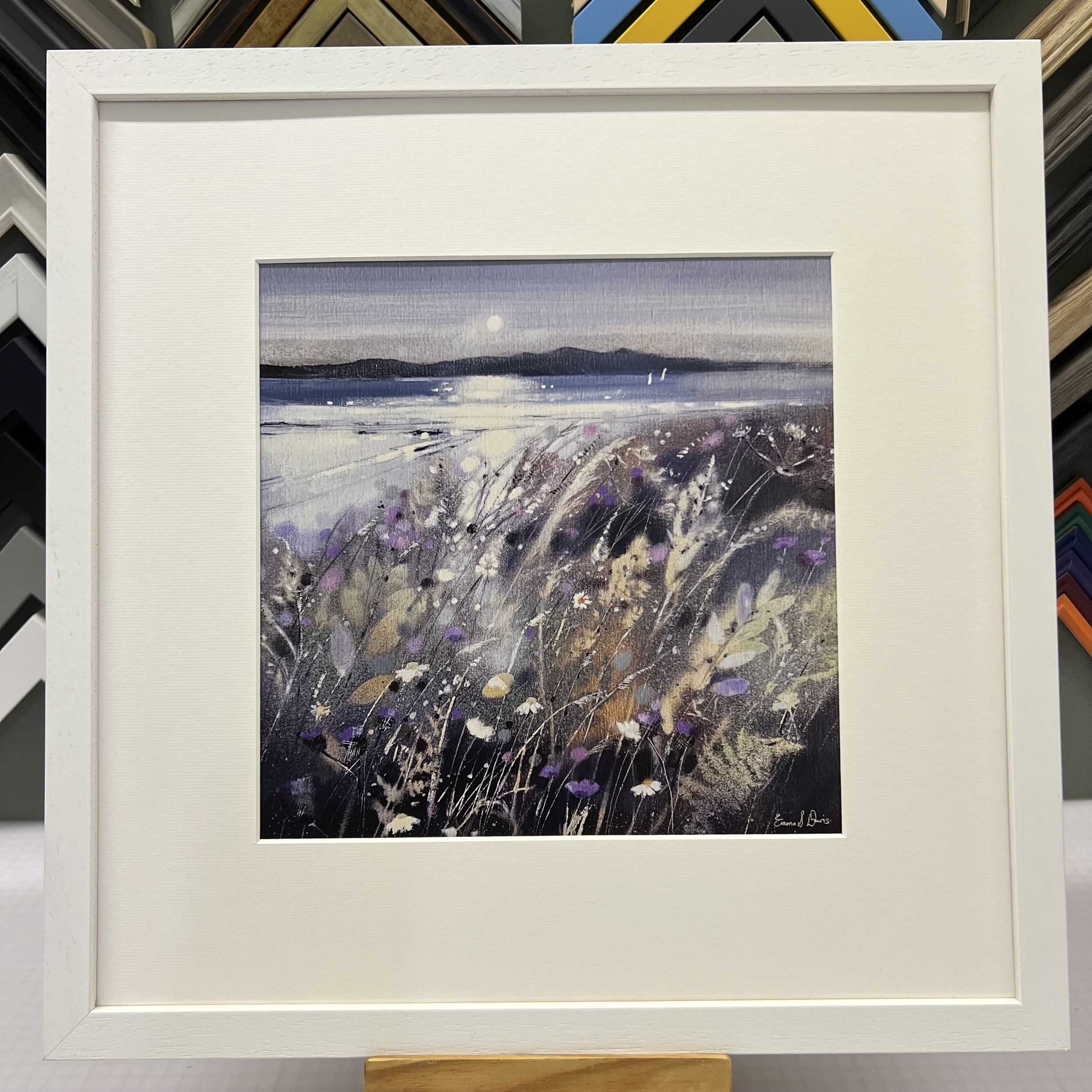 Summer Fields and Arran Open Edition Art Print by Emma S Davis. Presented in a white frame, showcasing Arran on the horizon and wildflowers dancing in the summer breeze.