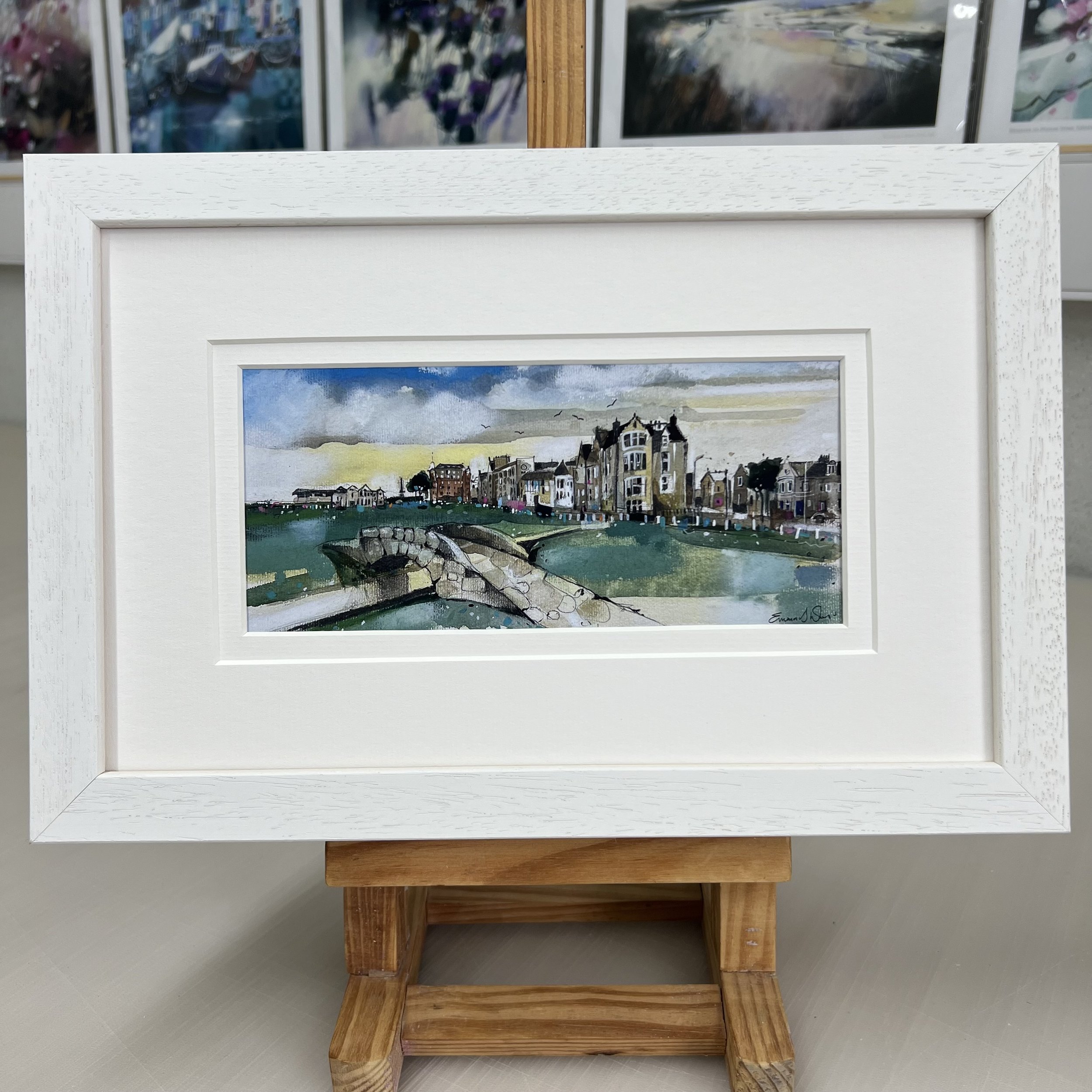 Framed Swilcan Bridge St Andrews artwork showing Old Course 18th green and clubhouse. White frame double mount