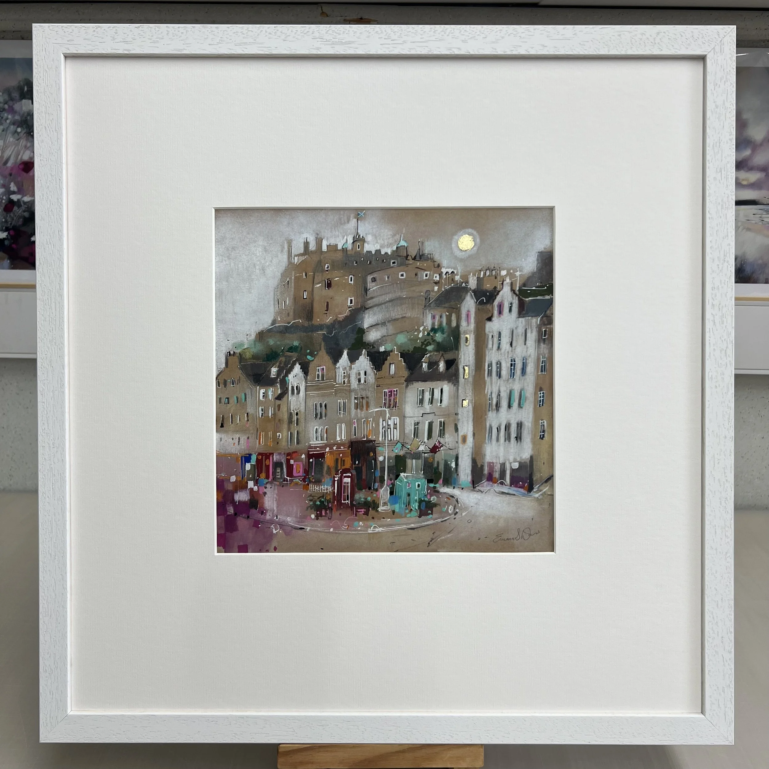 Moonlight, Grassmarket, Edinburgh by Emma S Davis – original mixed media artwork featuring Edinburgh Castle above the historic Grassmarket at dusk. Framed view.