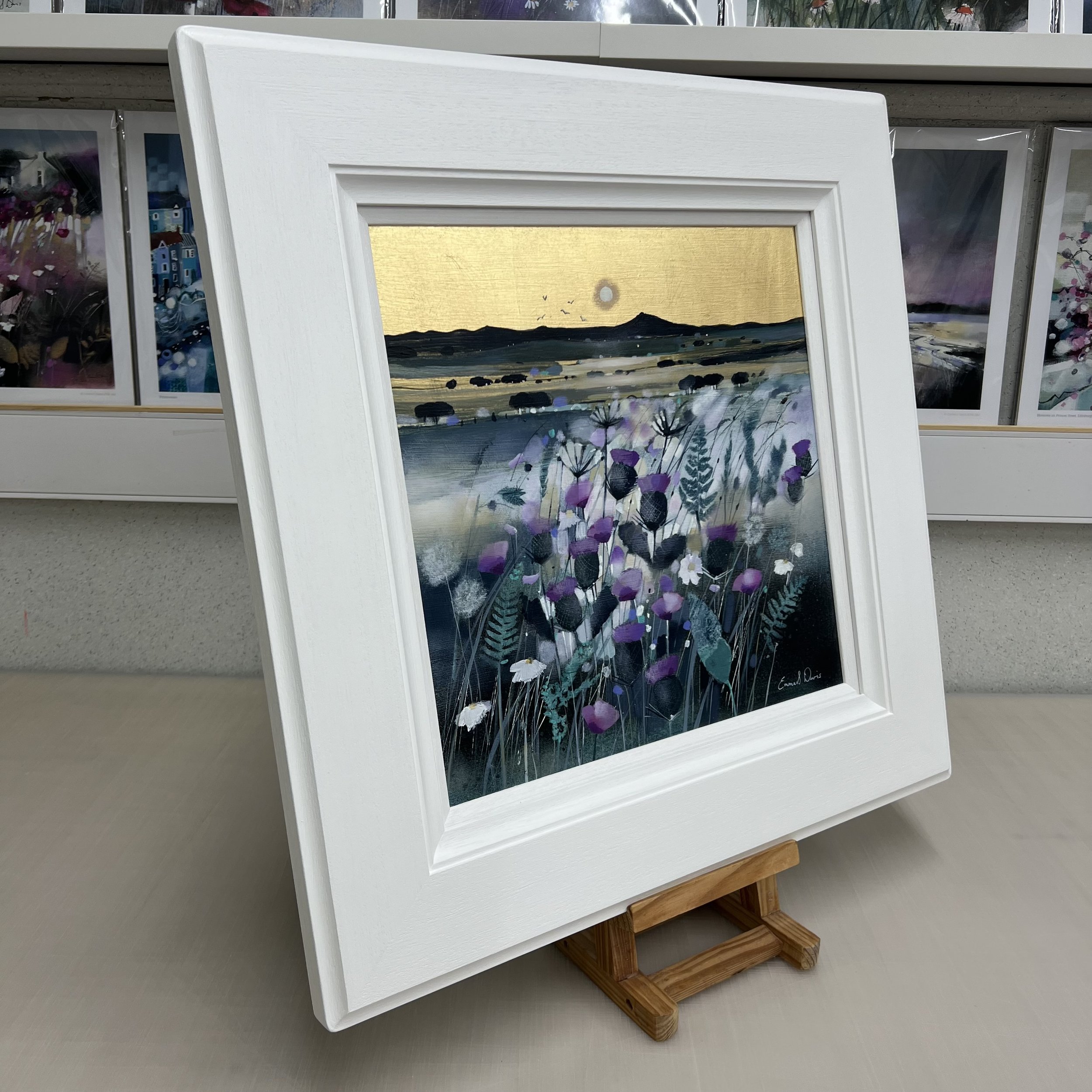 Bennachie at Moonlight original oil and gold leaf painting by Scottish artist Emma S Davis featuring Bennachie with wildflowers beneath a golden moonlit sky. Side view.