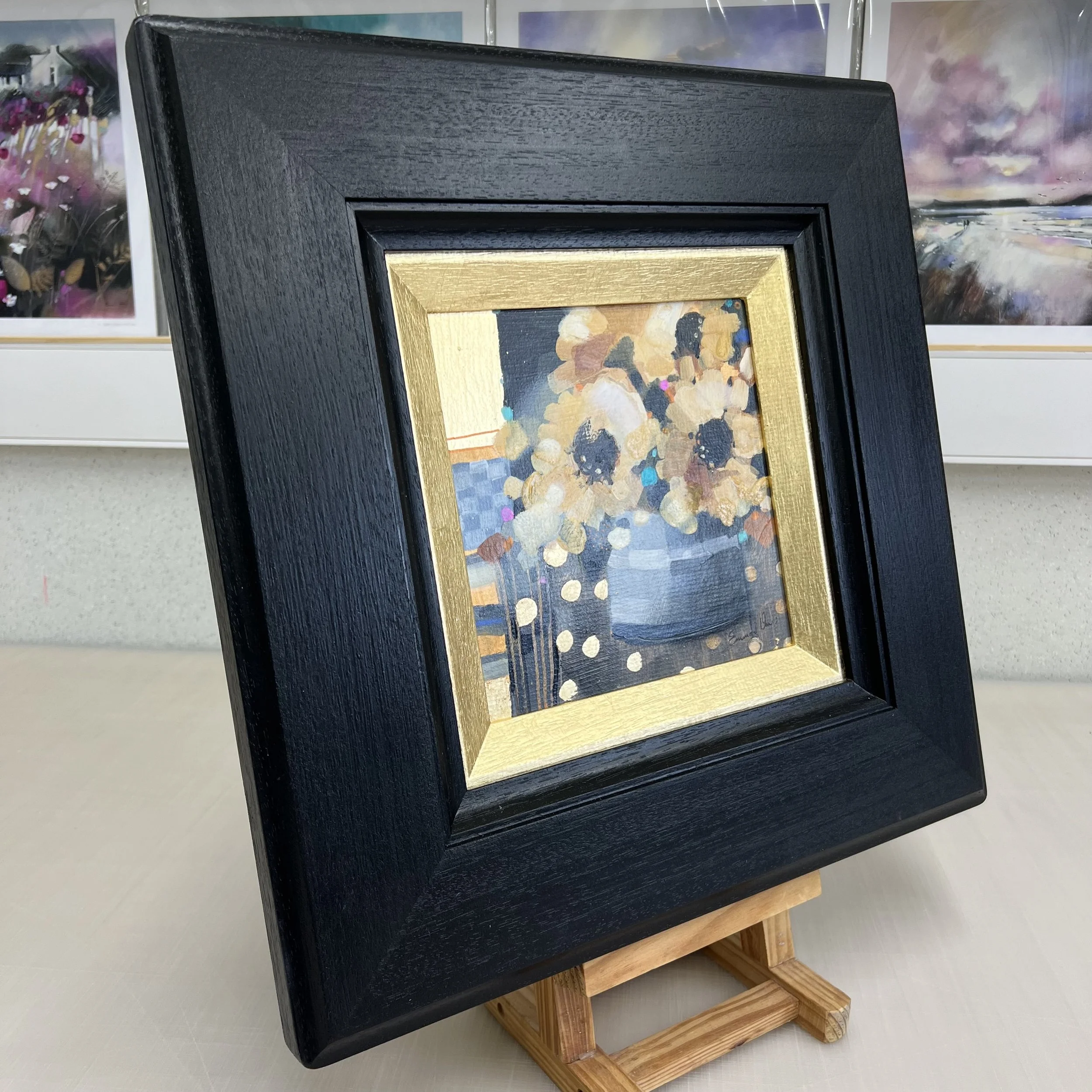 Original sunflower painting titled Towards the Sun showing bright yellow sunflowers in a vase by Emma S Davis. Side view.