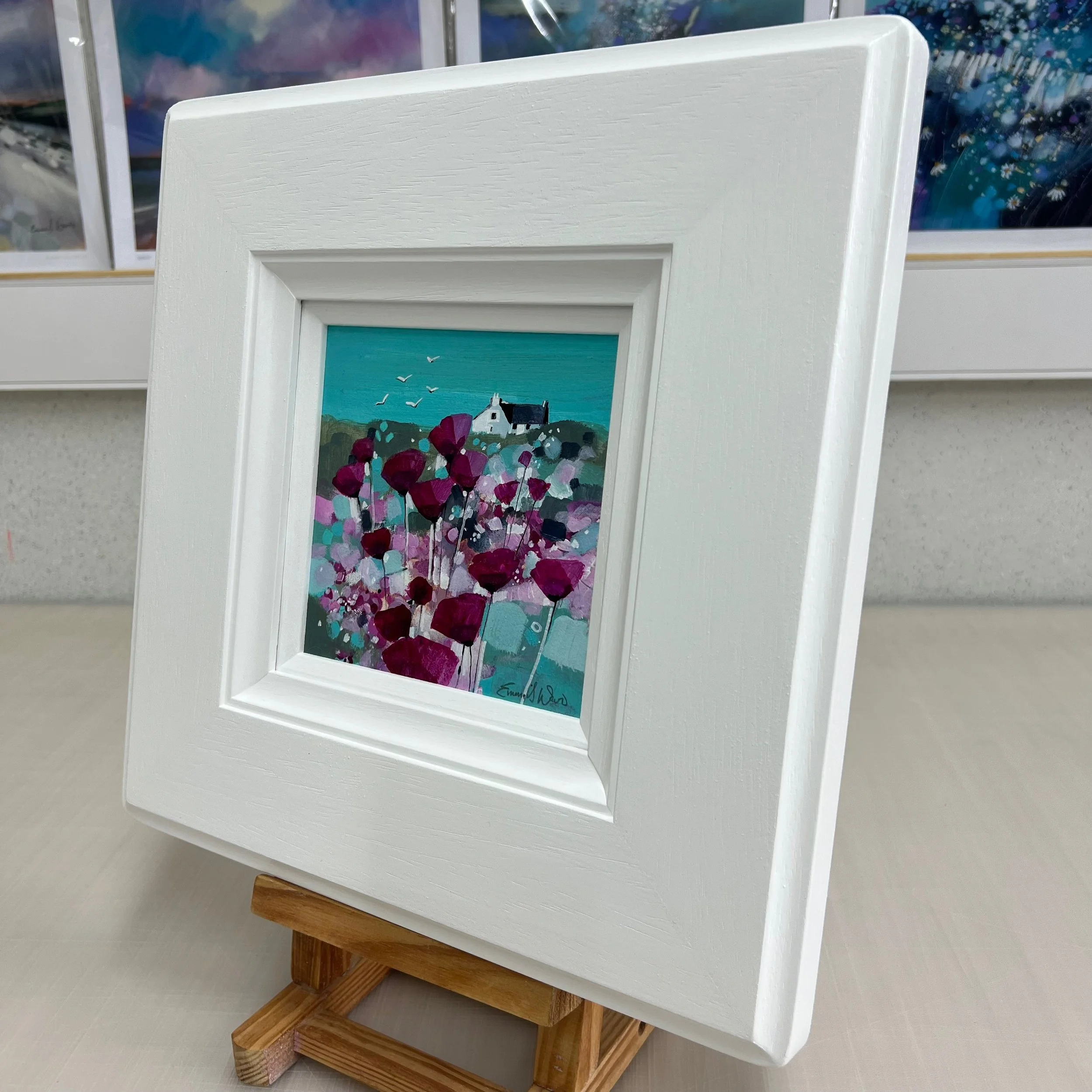 'Together Flying High' - a colourful abstract landscape in this original small oil painting in white frame by Emma S Davis Artist - side view