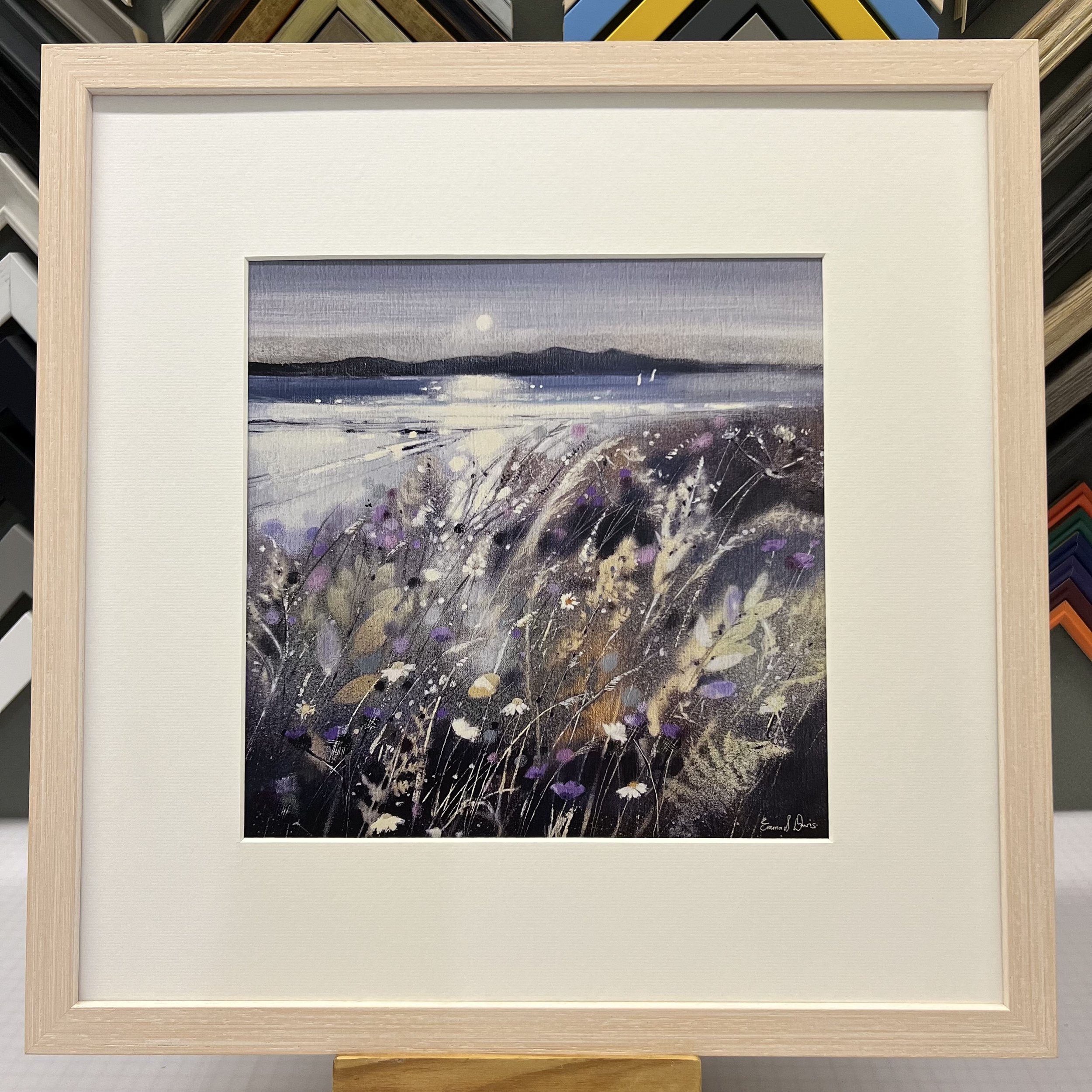 Summer Fields and Arran Open Edition Art Print by Emma S Davis. Presented in a limewash frame, showcasing Arran on the horizon and wildflowers dancing in the summer breeze.