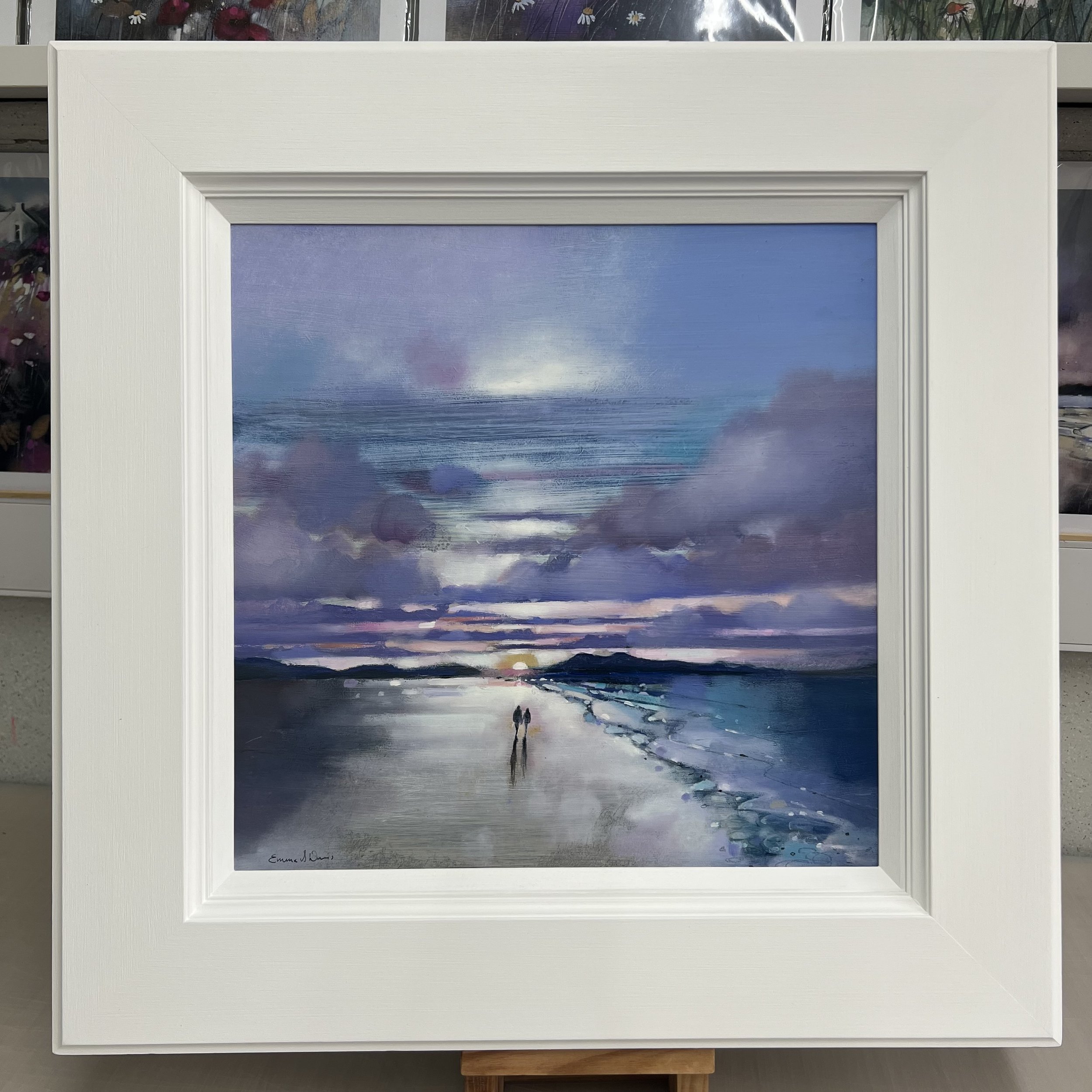 Original oil painting of a couple walking along Luskentyre Beach on the Isle of Harris in the Outer Hebrides at sunset by Scottish artist Emma S Davis. Framed view.
