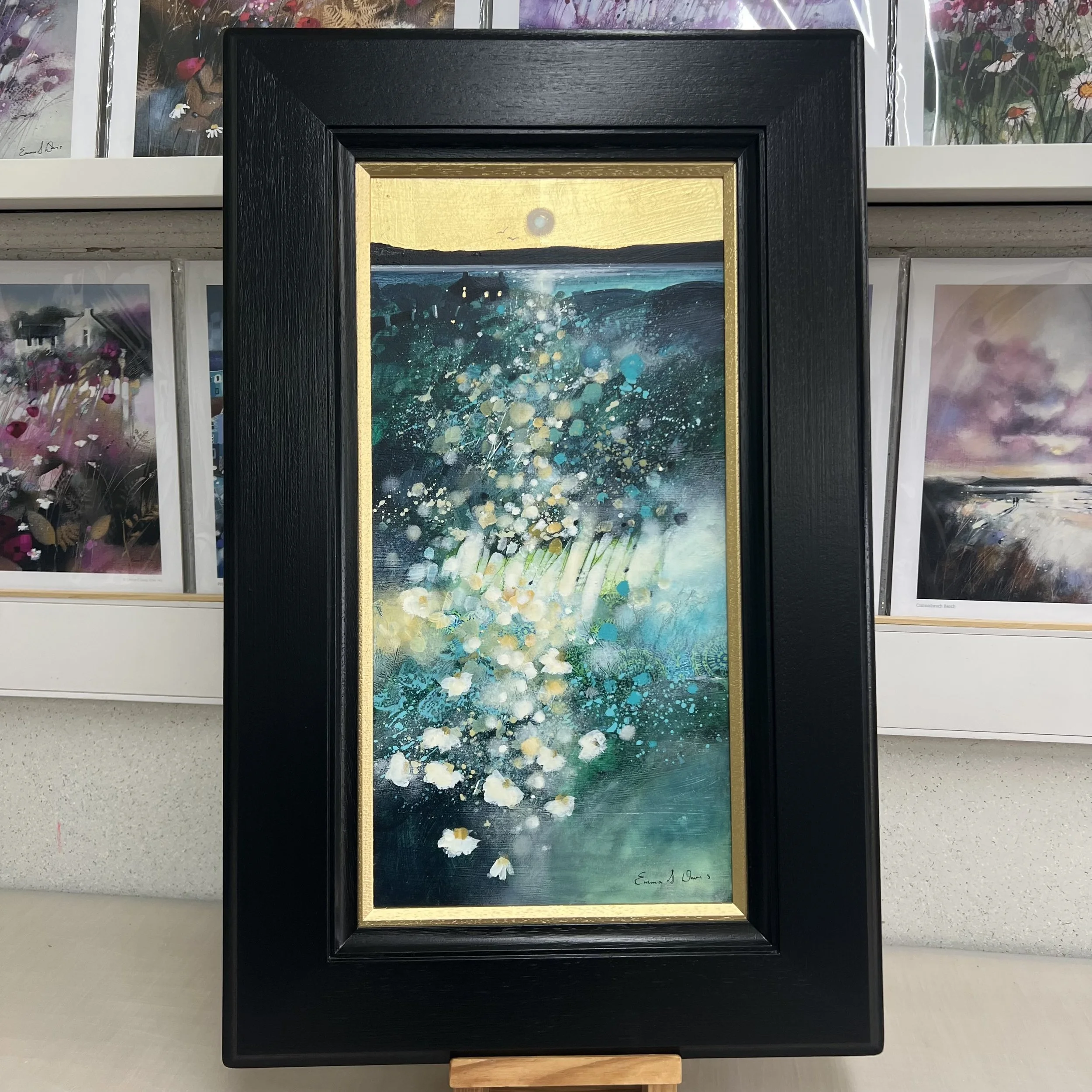 Original oil painting with gold leaf of white machair flowers overlooking the turquoise sea in the Outer Hebrides by Scottish artist Emma S Davis. Framed view.
