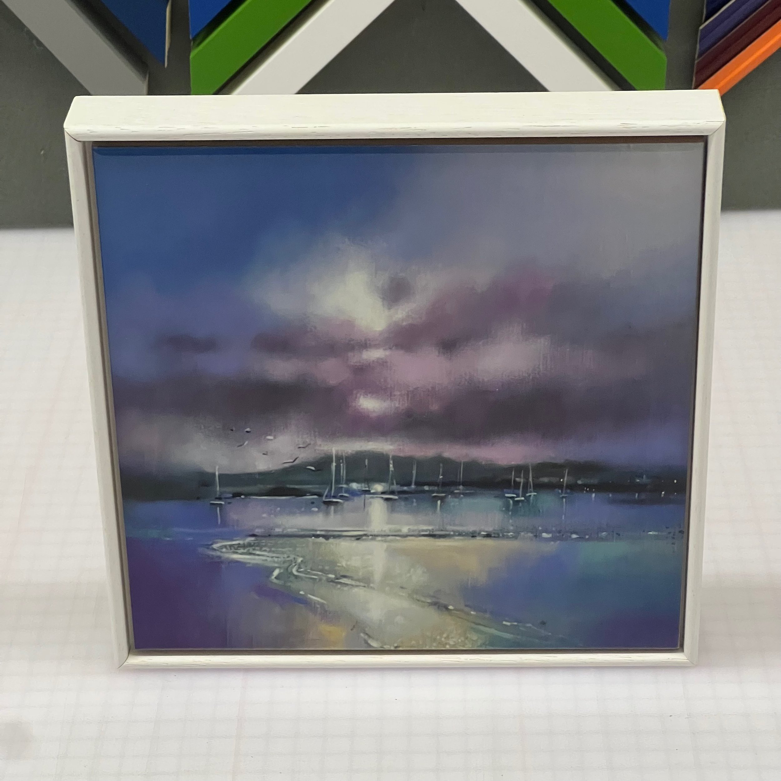 Elevate your surroundings with Emma S Davis Artist's framed ceramic tile art print of 'Millport Memories' Bring the allure of Scottish landscapes into your home.