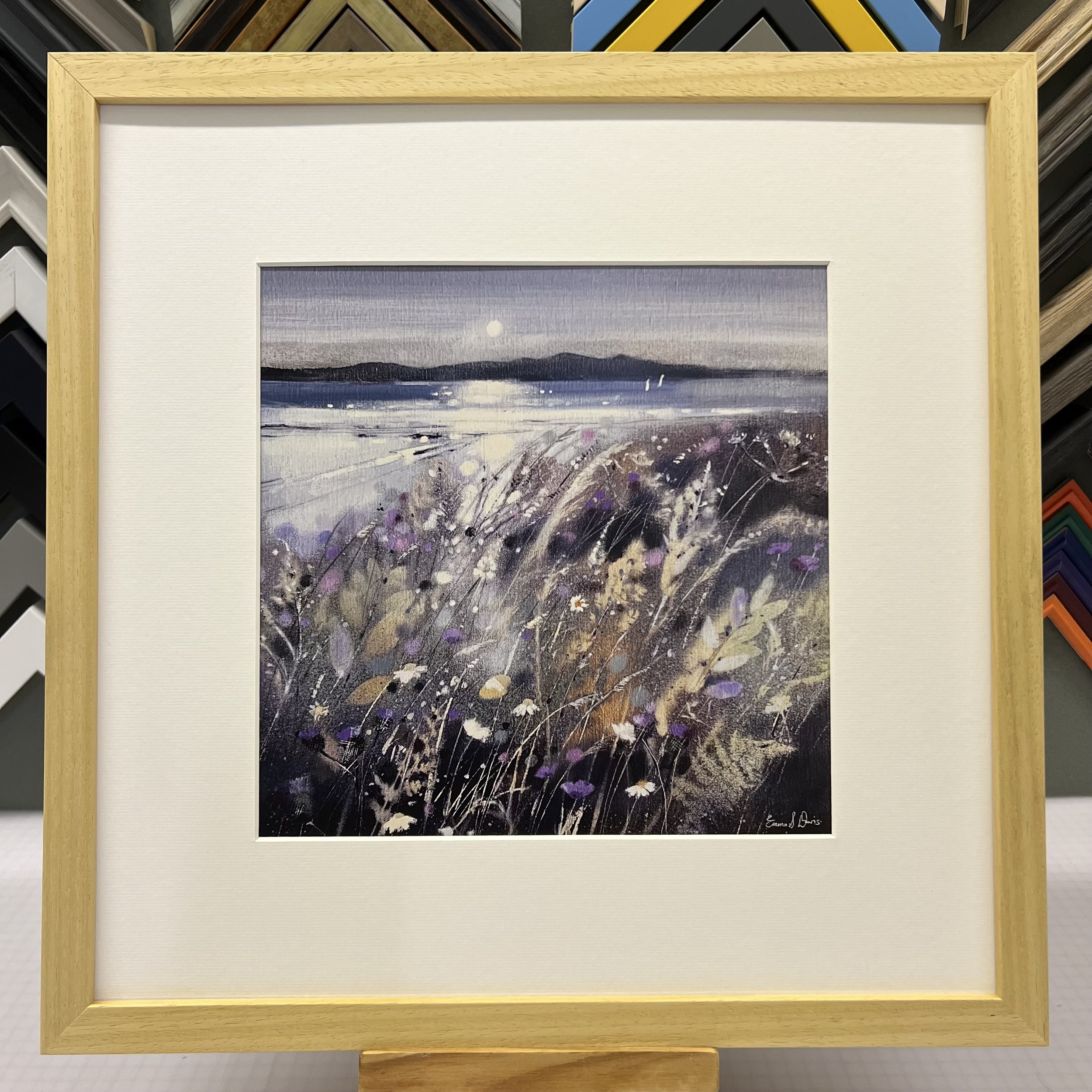 Summer Fields and Arran Open Edition Art Print by Emma S Davis. Presented in a natural frame, showcasing Arran on the horizon and wildflowers dancing in the summer breeze.