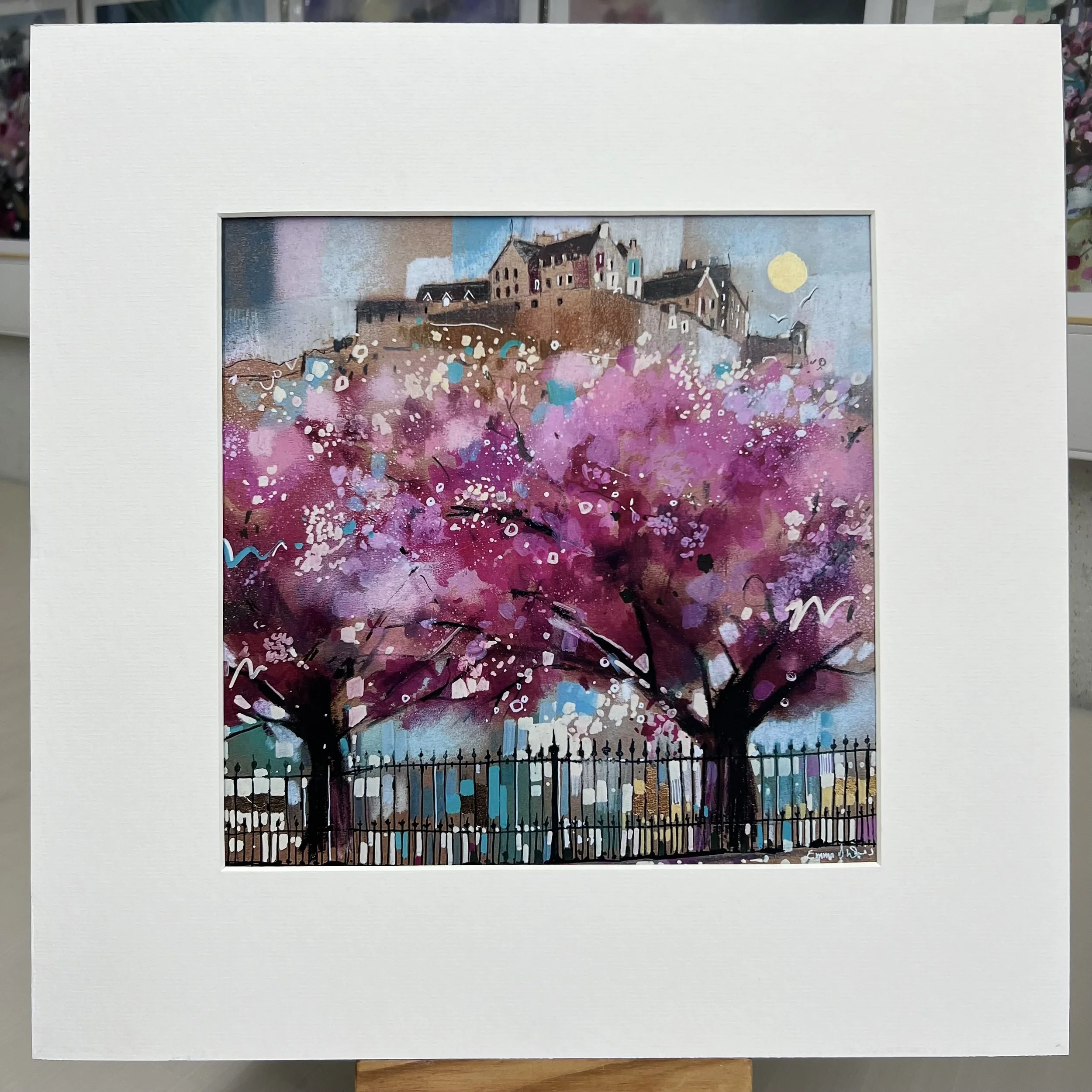 Edinburgh in Bloom artwork featuring Edinburgh Castle above blossom trees in Princes Street Gardens, Scotland. Mounted option.