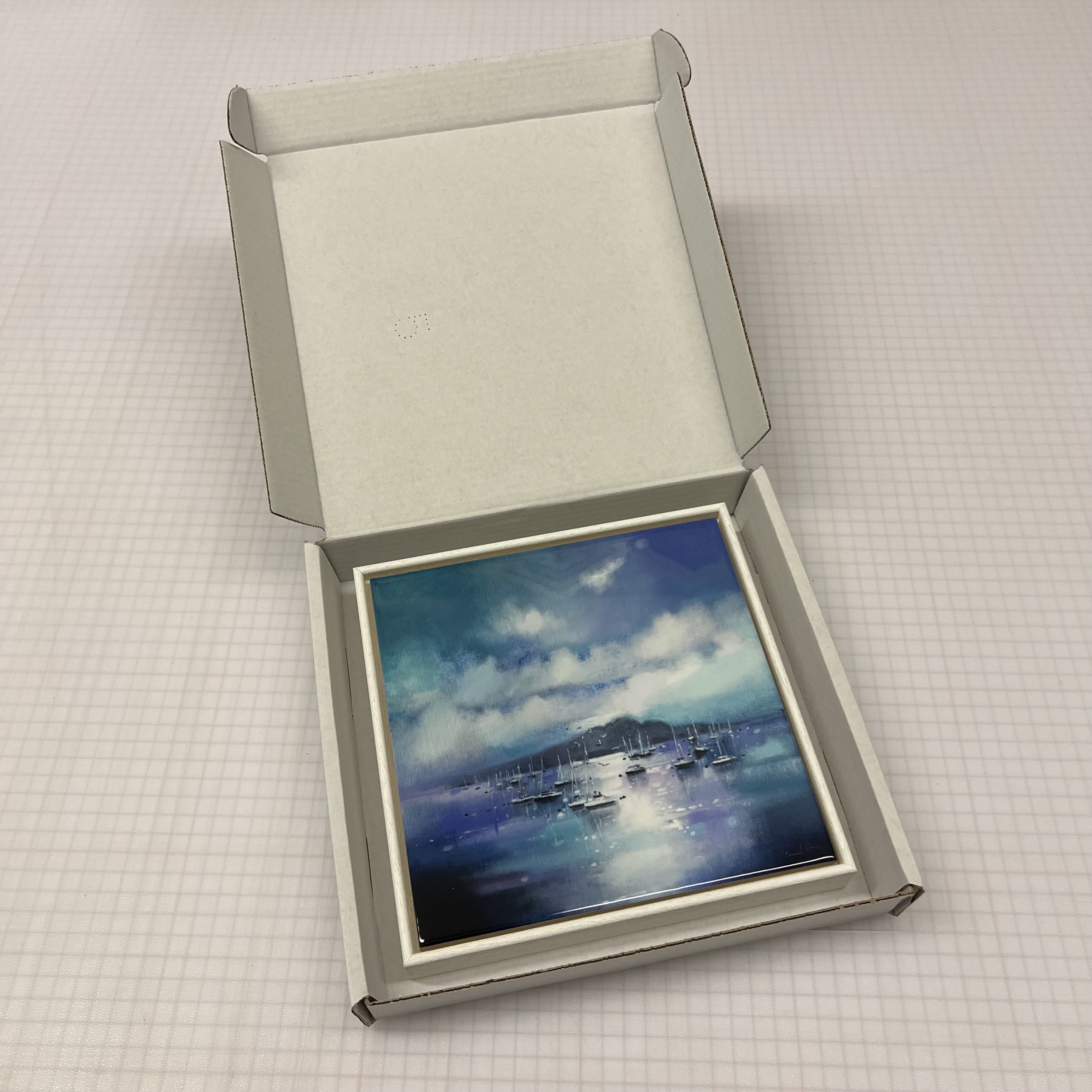 Experience the beauty of Holy Isle Moorings, Arran by Emma S Davis Artist in your space. Elevate your home with this framed ceramic tile, embracing the allure of the Scottish landscape.