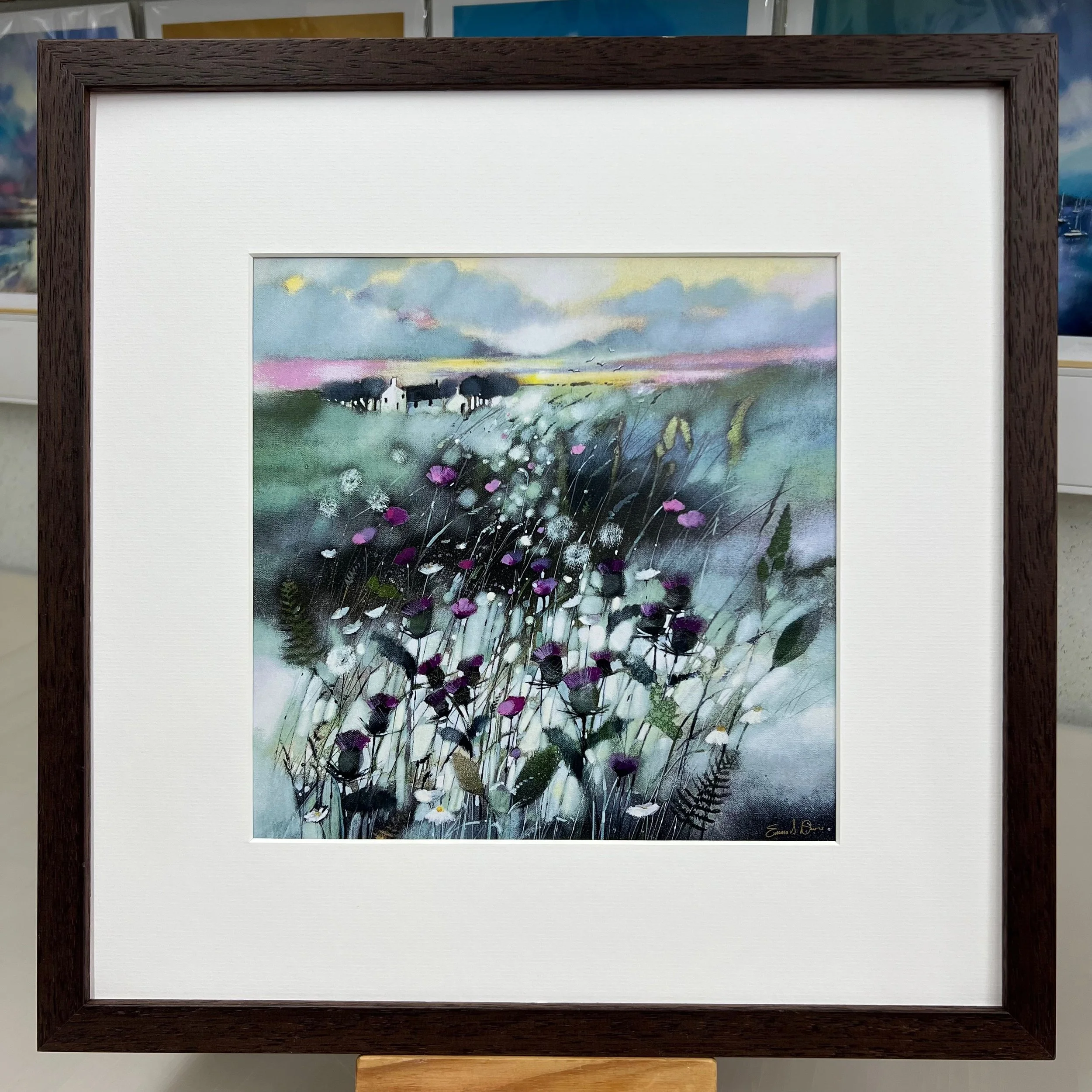 tThe thistle, Scotland's national flower, dominates the landscape in Emma S Davis Artist's open edition art print in brown frame.