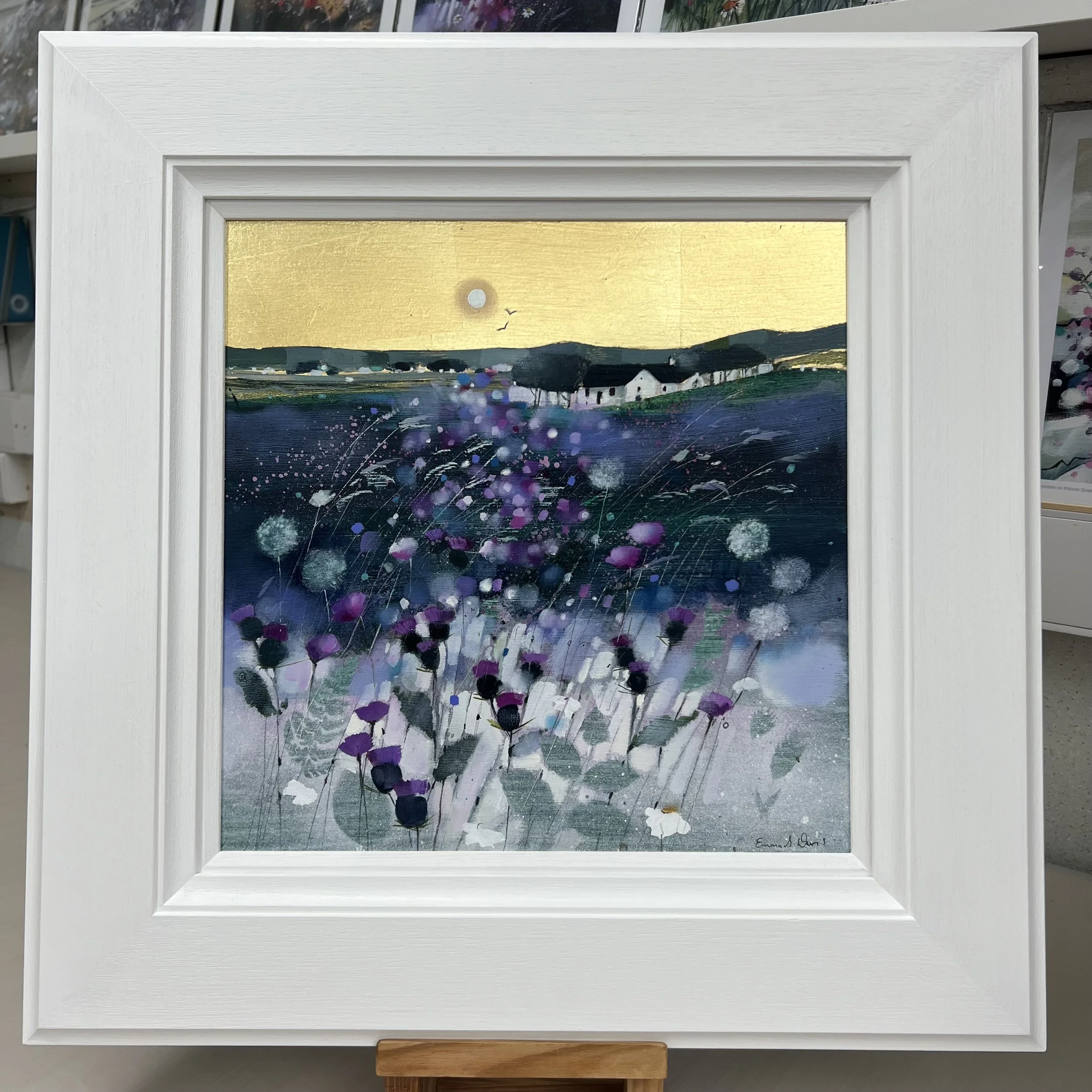 Original oil painting with gold leaf of Highland crofts, purple thistles, wildflowers and dandelion clocks in the Scottish Highlands by Scottish artist Emma S Davis. Framed view.