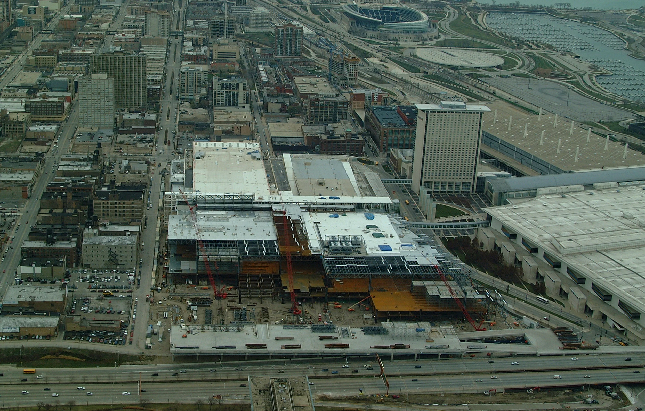 McCormick Place West Expansion: Creating Economic Opportunity for Chicago Residents and MBE/WBE Firms In July 2007, a Clark-led joint venture successfully completed the $882.5 million McCormick Place West Expansion nearly four months ahead of schedule. The project added 2.3 million square feet to the existing McCormick Place Convention Center, where the same Clark-led joint venture had completed the $676 million South Hall expansion in December 1996. With 88% overall local participation on the project, the West Expansion exceeded all MBE/WBE and workforce hiring goals. - MBE Participation - Goal 25.0% | Actual: 28.84% - WBE Participation - Goal 5.0% | Actual: 6.43% Community Benefits Agreement: - Provided prompt payment and mobilization funding to MBE/WBE firms - 13 minority scholarships awarded to UIC or IIT - Hosted Construction Careers Awareness Fairs - Utilized “Build Chicago” apprenticeship preparedness programs, with 62% of graduates hired by project subcontractors - Started Mc4West Summer Construction Institute for local high school students - Started the Saturday Engineering Academy for local 6th graders