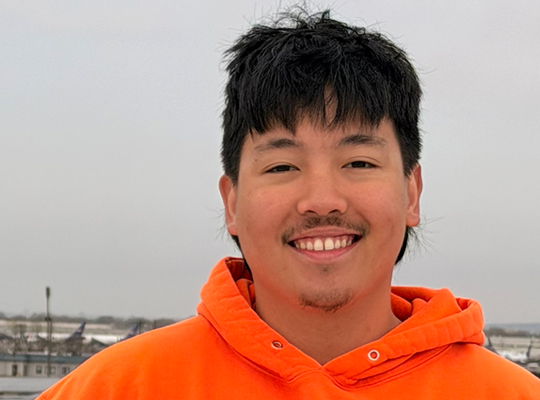 headshot of Casey Angelo Poloyapoy on a rooftop