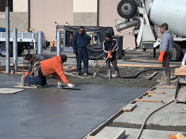 Thick concrete slab and drain for truck clean-out