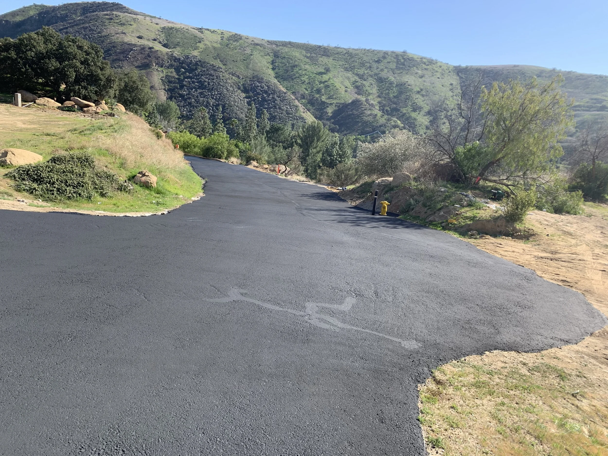 Asphalt overlay and sealcoat