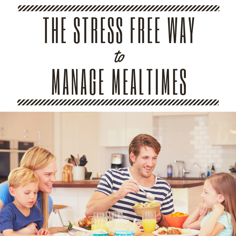 The Stress Free Way to Manage Mealtimes [picture of a family eating dinner smiling and talking. One child sits on the mother’s lap.