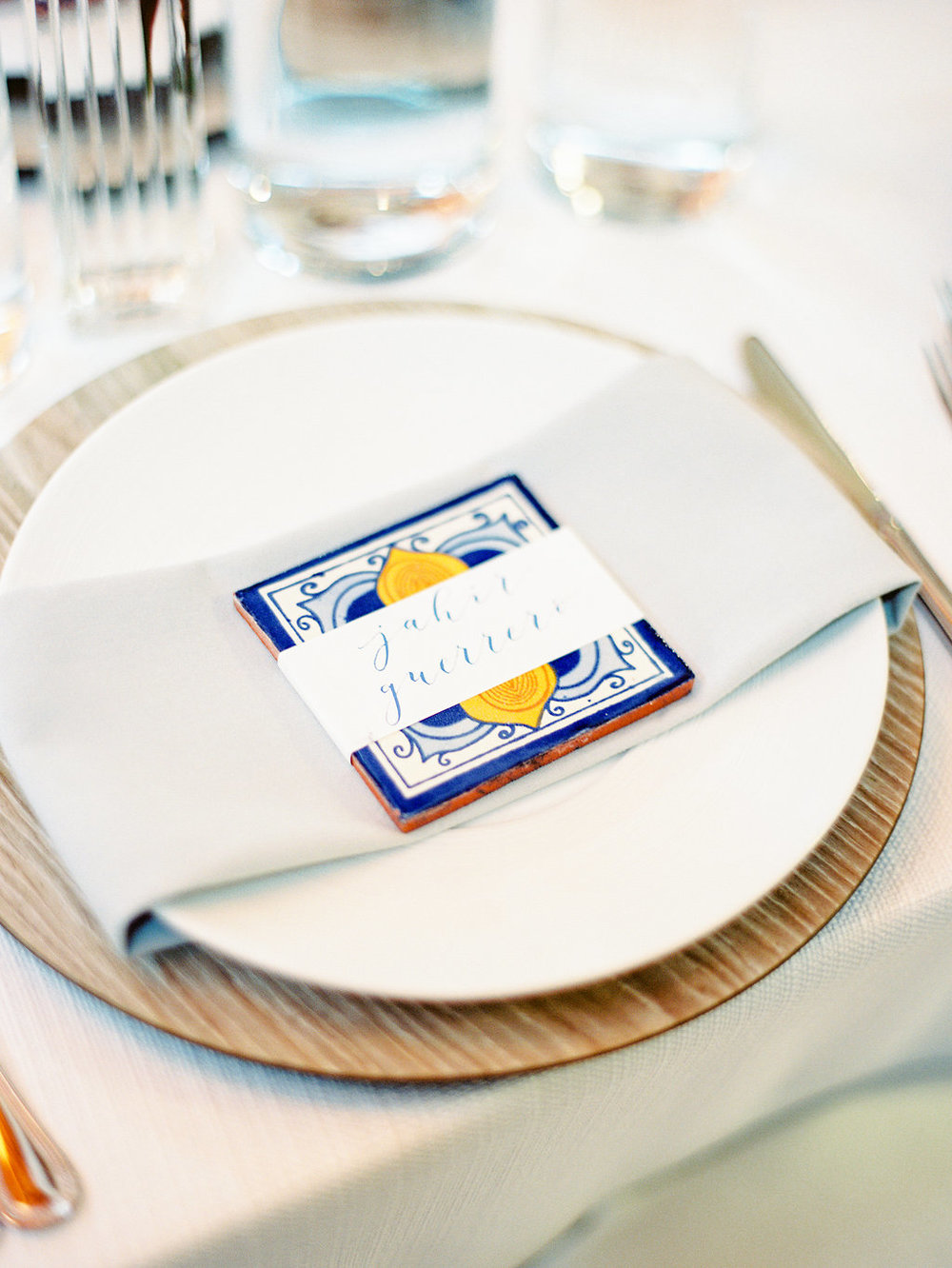 Wedding place setting with Spanish tile and calligraphy placecard